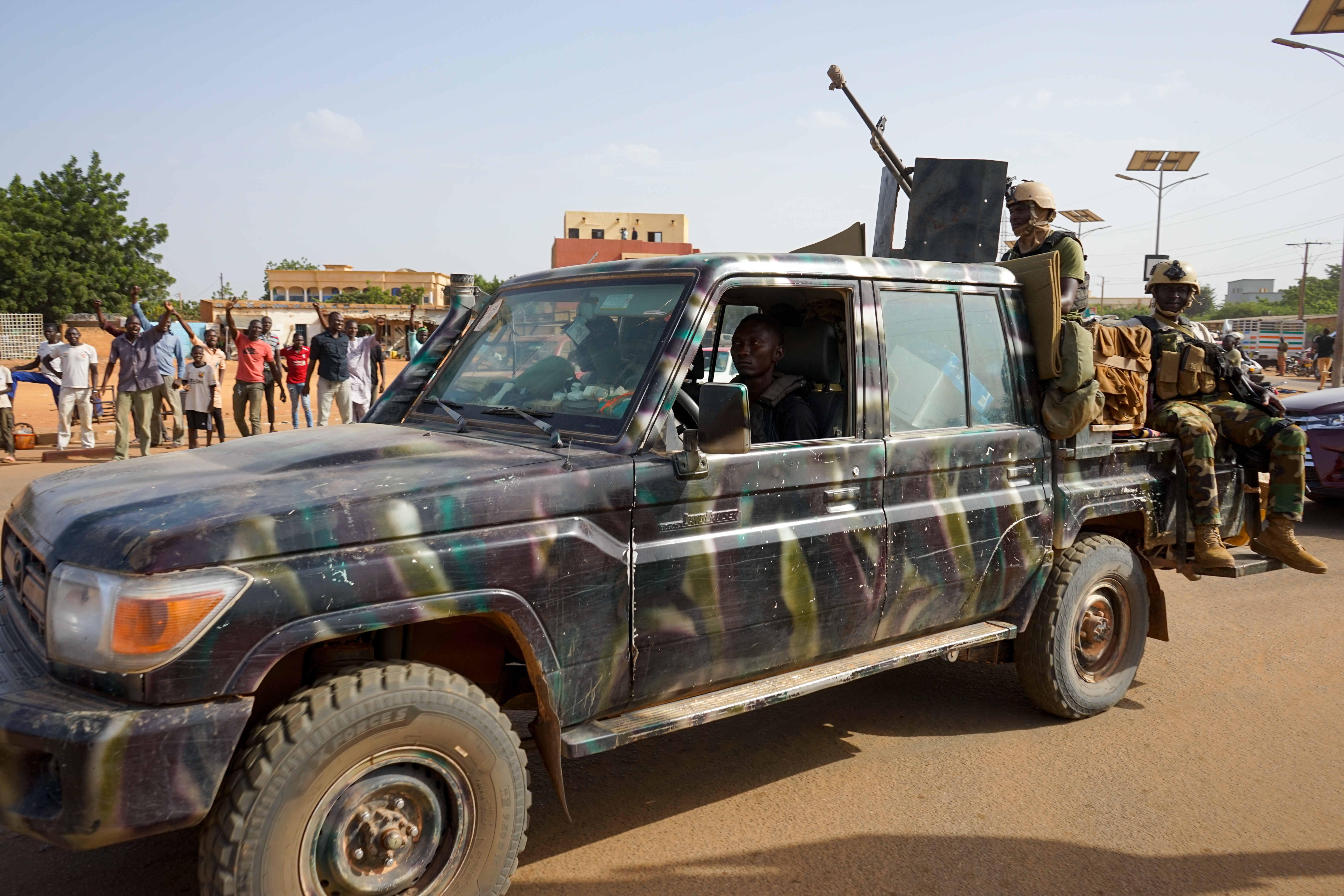 epa10911753 Nigerien soldiers escort vehicles of the first French military convoy to leave Niger as they drive out of Niamey, Niger, 10 October 2023. The operation for the withdrawal of the French military in Niger has started on 10 October, months after the Nigerien generals who ousted democratically elected President Bazou in June demanded the withdrawal of some 1,400 French soldiers from the country. EPA/ISSFOU DJIBO