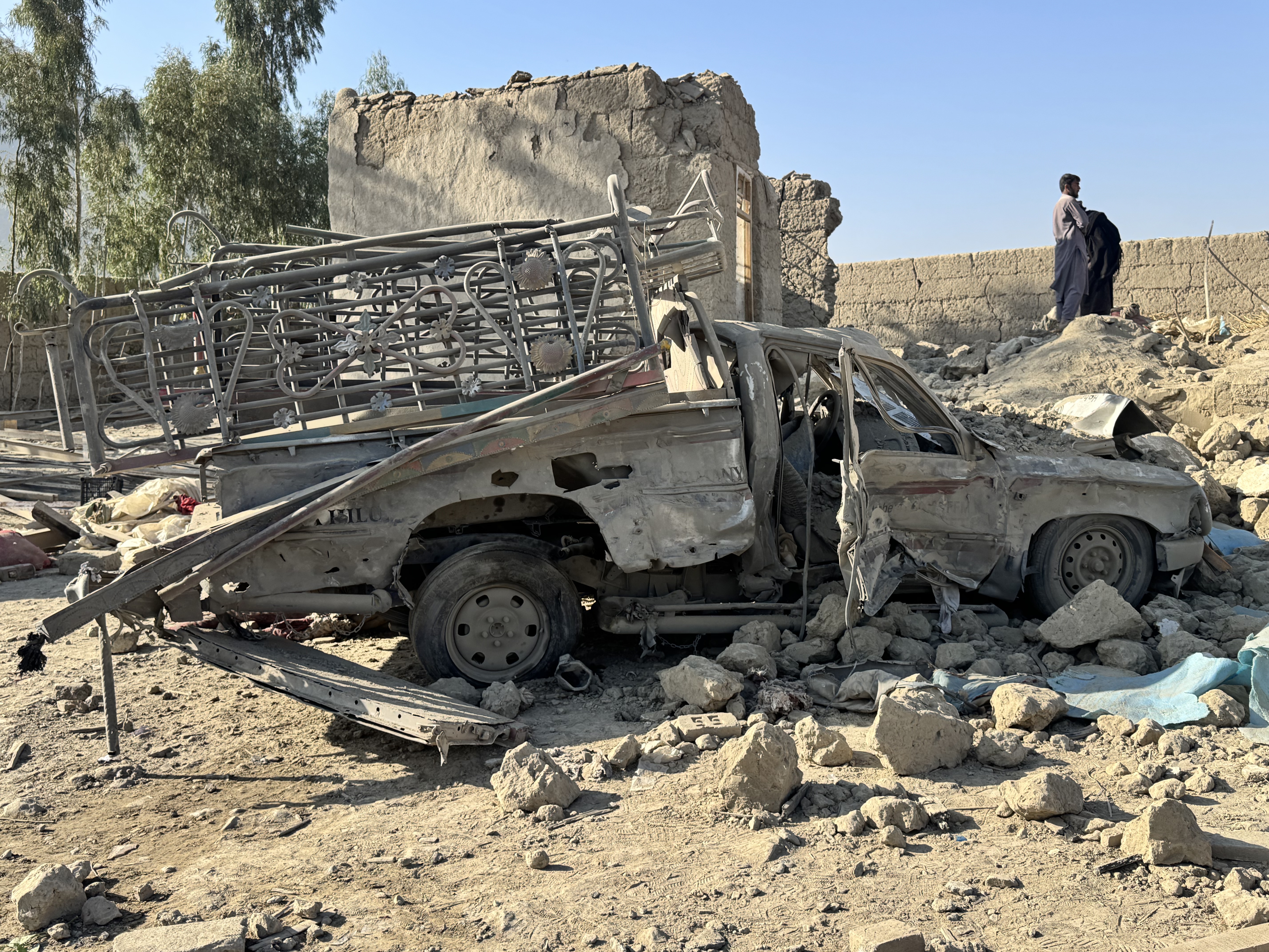 epa12767584 Taliban security officials inspect the scene of an alleged Pakistani airstrike near the Pak-Afghan border in Nangarhar