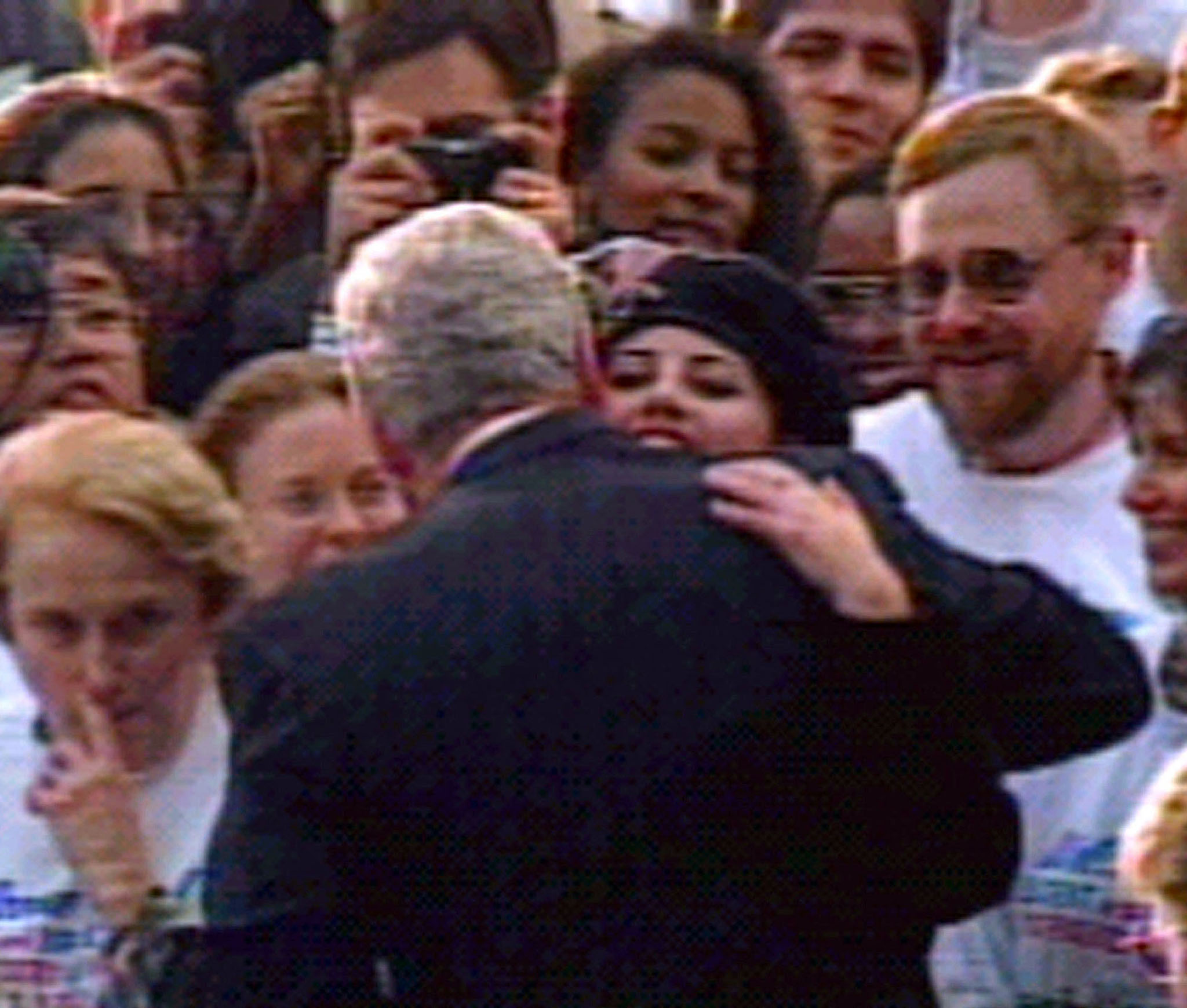 File photo of former White House intern Monica Lewinsky hugging U.S. President Bill Clinton