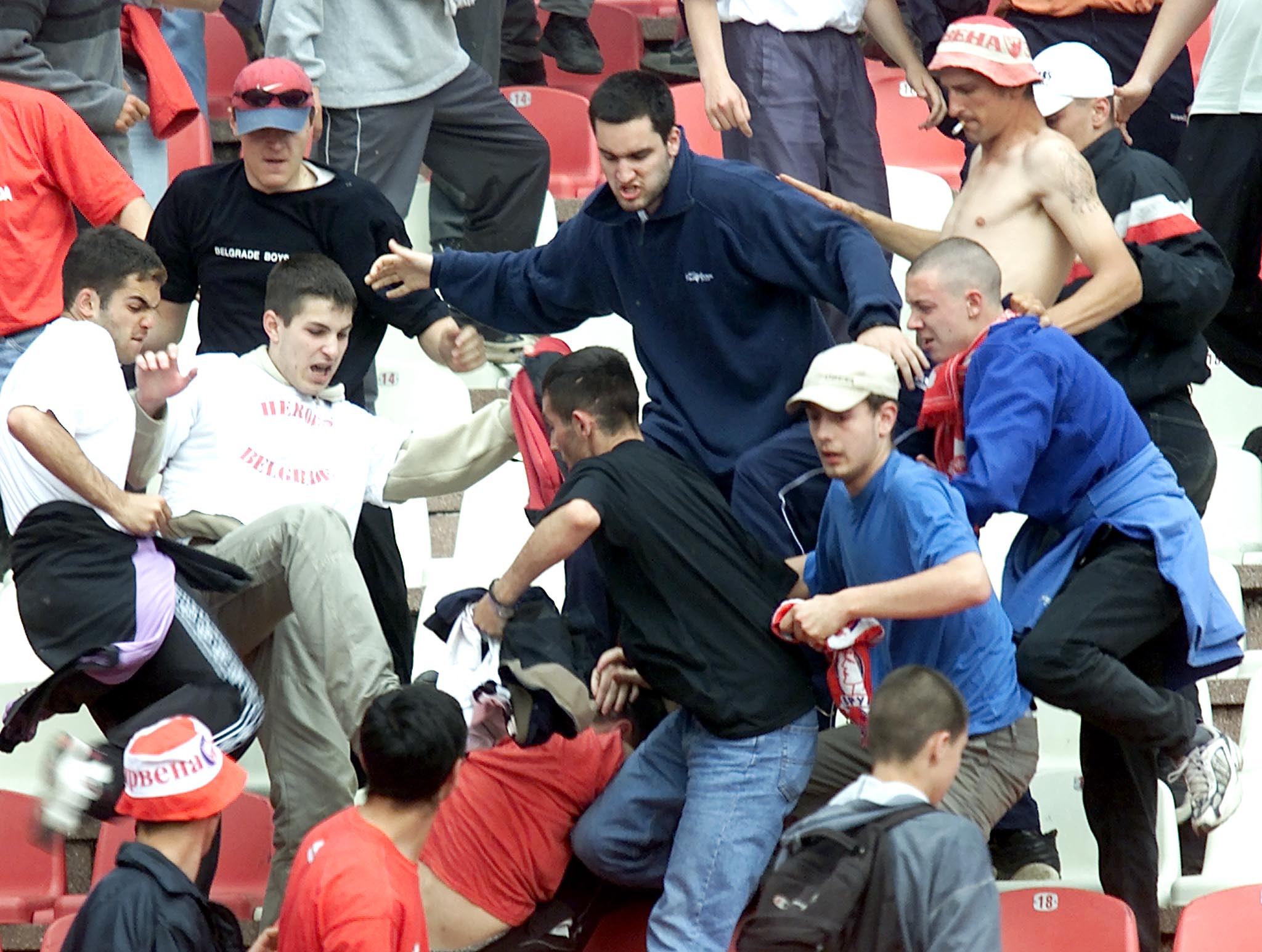 Red Star soccer fans fight each other during Yugoslav Cup final match against Partizan in Belgrade May 9, 2001. The arch rivals are also the only remaining contenders for the Yugoslav league title.