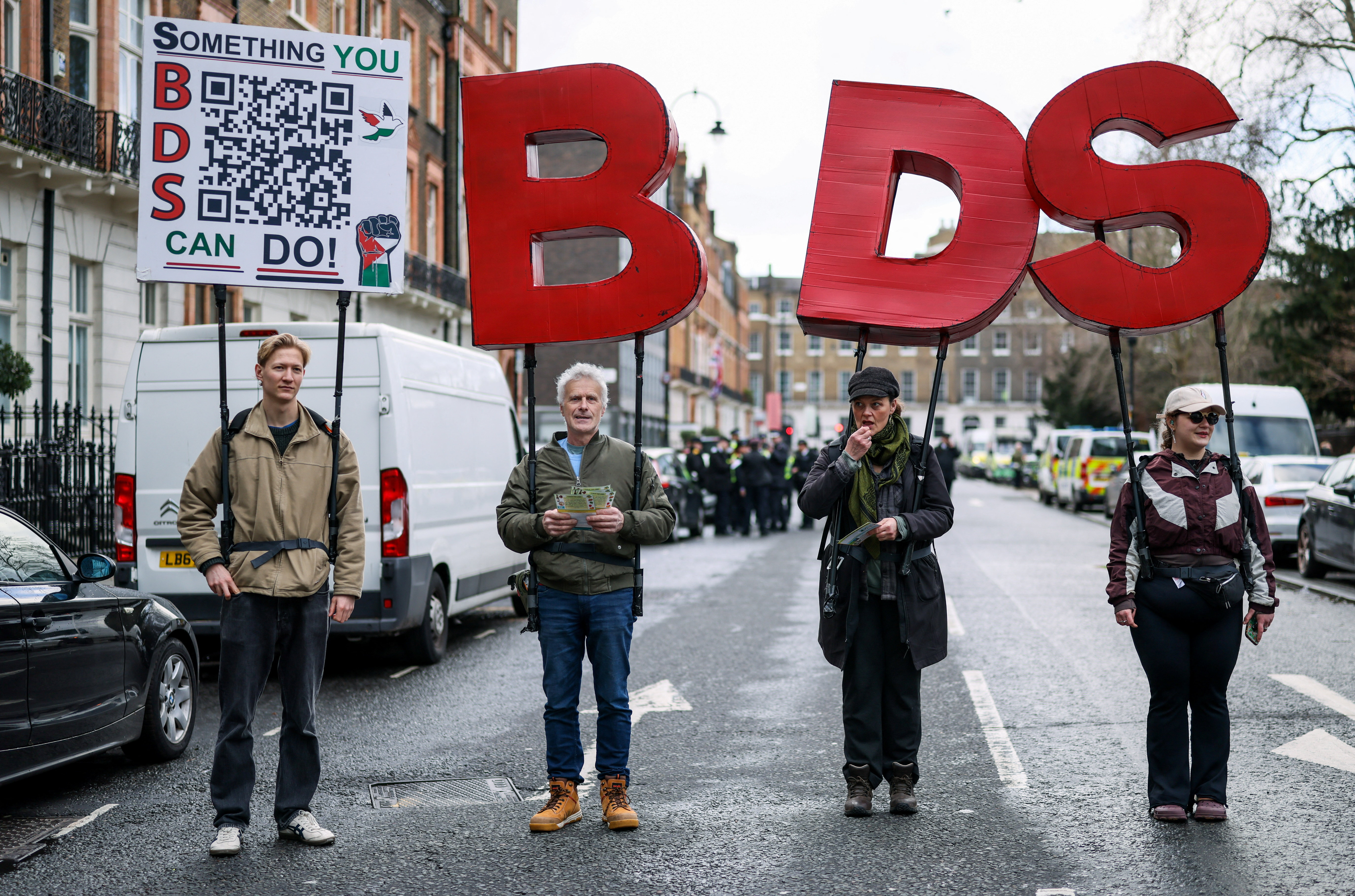 People hold "BDS" letters, referring to the "Boycott, Divest, Sanction" movement, during the National March for Palestine - hands off Gaza, a pro-Palestinian protest calling for the government to "end the genocide and stop arming Israel", in London, Britain, January 31, 2026. REUTERS/Jack Taylor