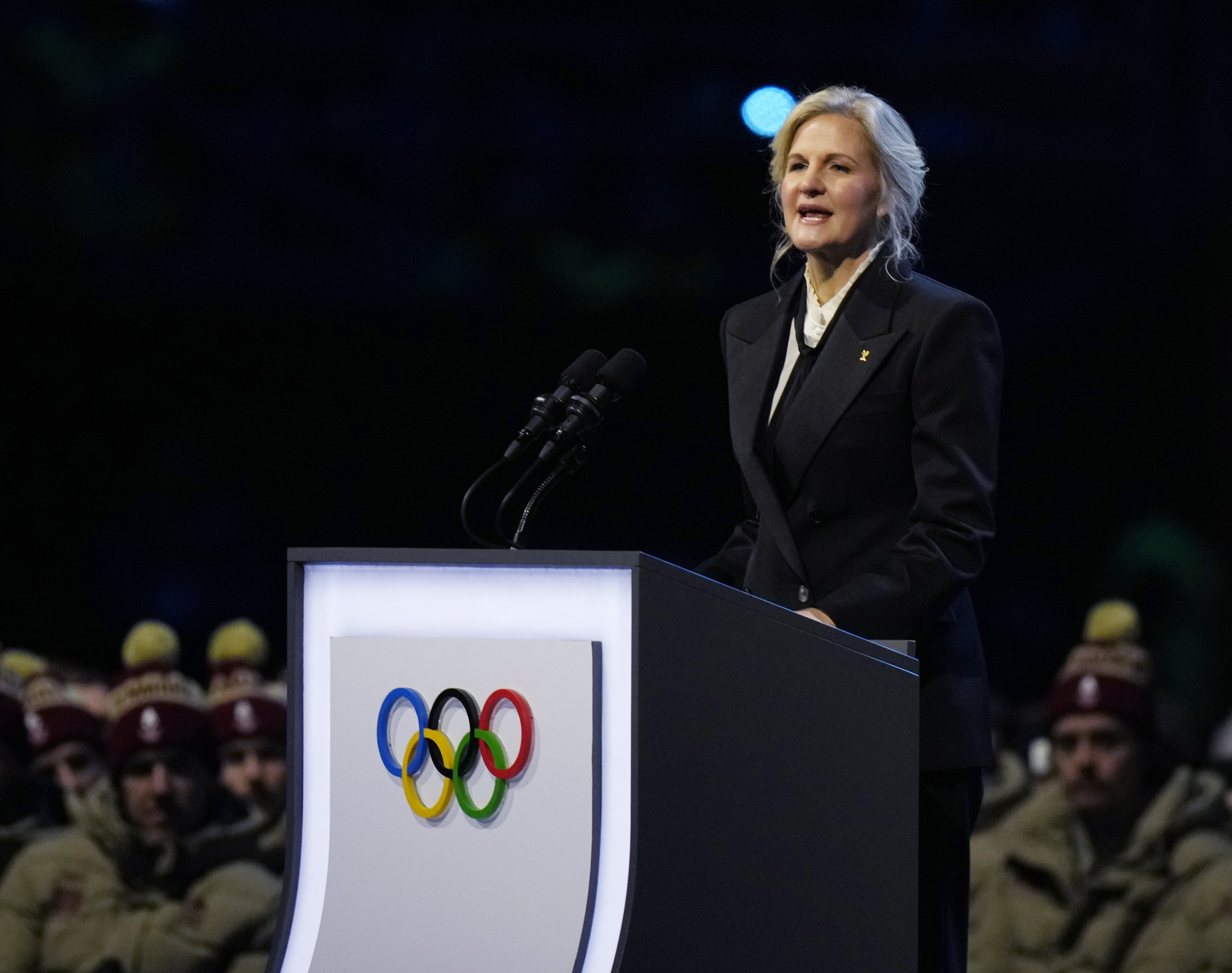 President Kirsty Coventry speaks at a stadium.