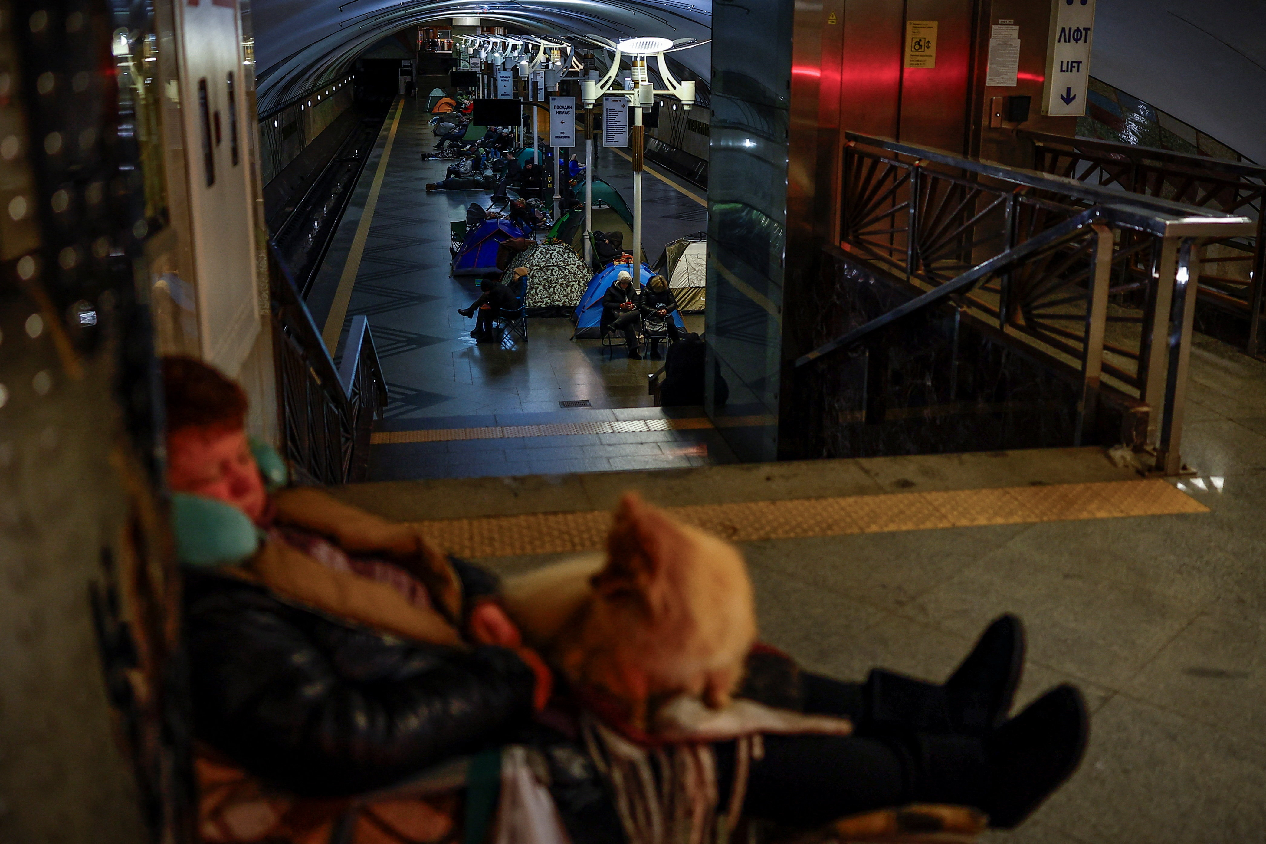 People sleep as they take shelter inside a metro station during a Russian overnight missile and drone strike, amid Russia's attack on Ukraine, in Kyiv, Ukraine February 7, 2026. REUTERS/Alina Smutko TPX IMAGES OF THE DAY