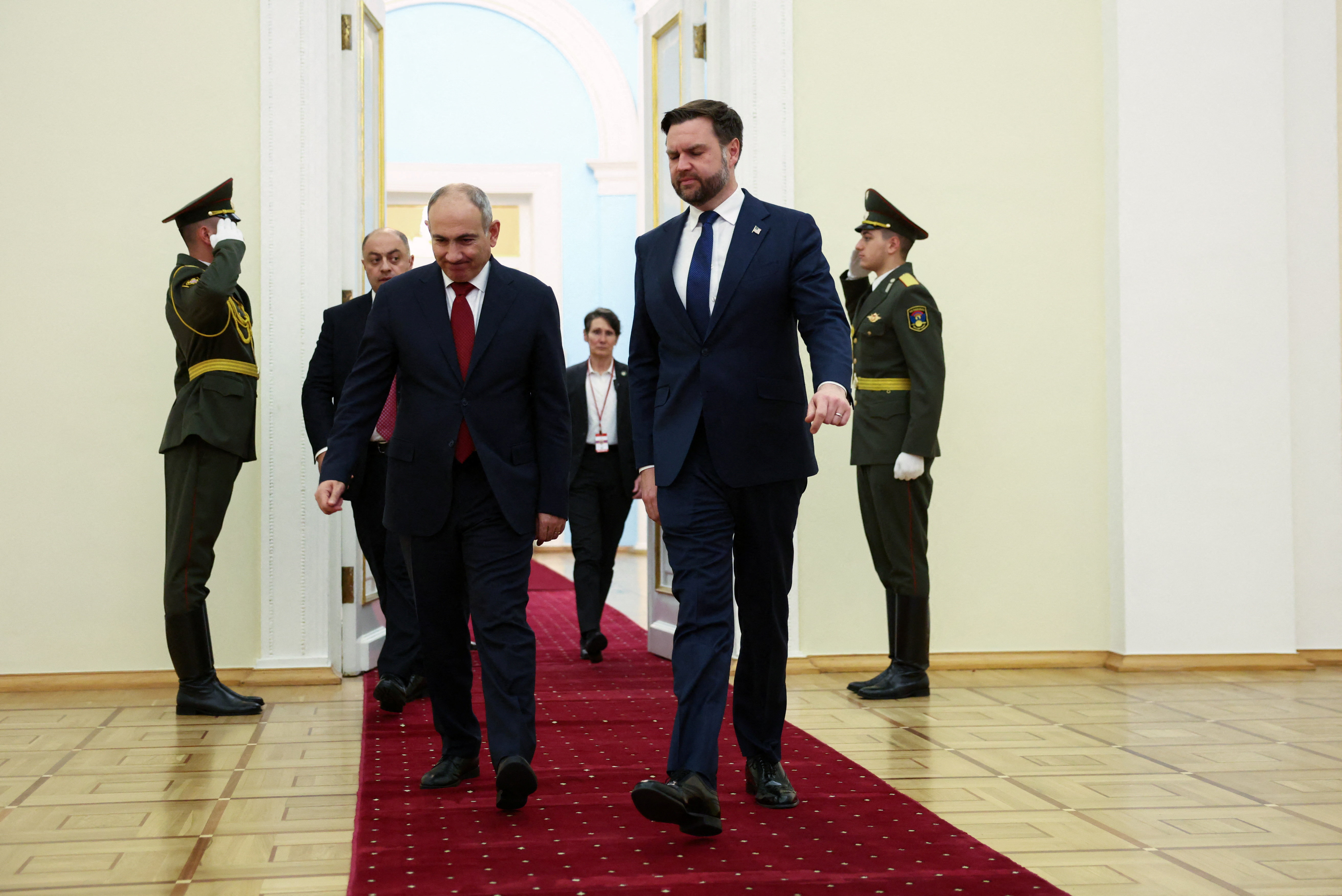 U.S. Vice President JD Vance and Armenia's Prime Minister Nikol Pashinyan walk together to hold a joint press conference in Yerevan
