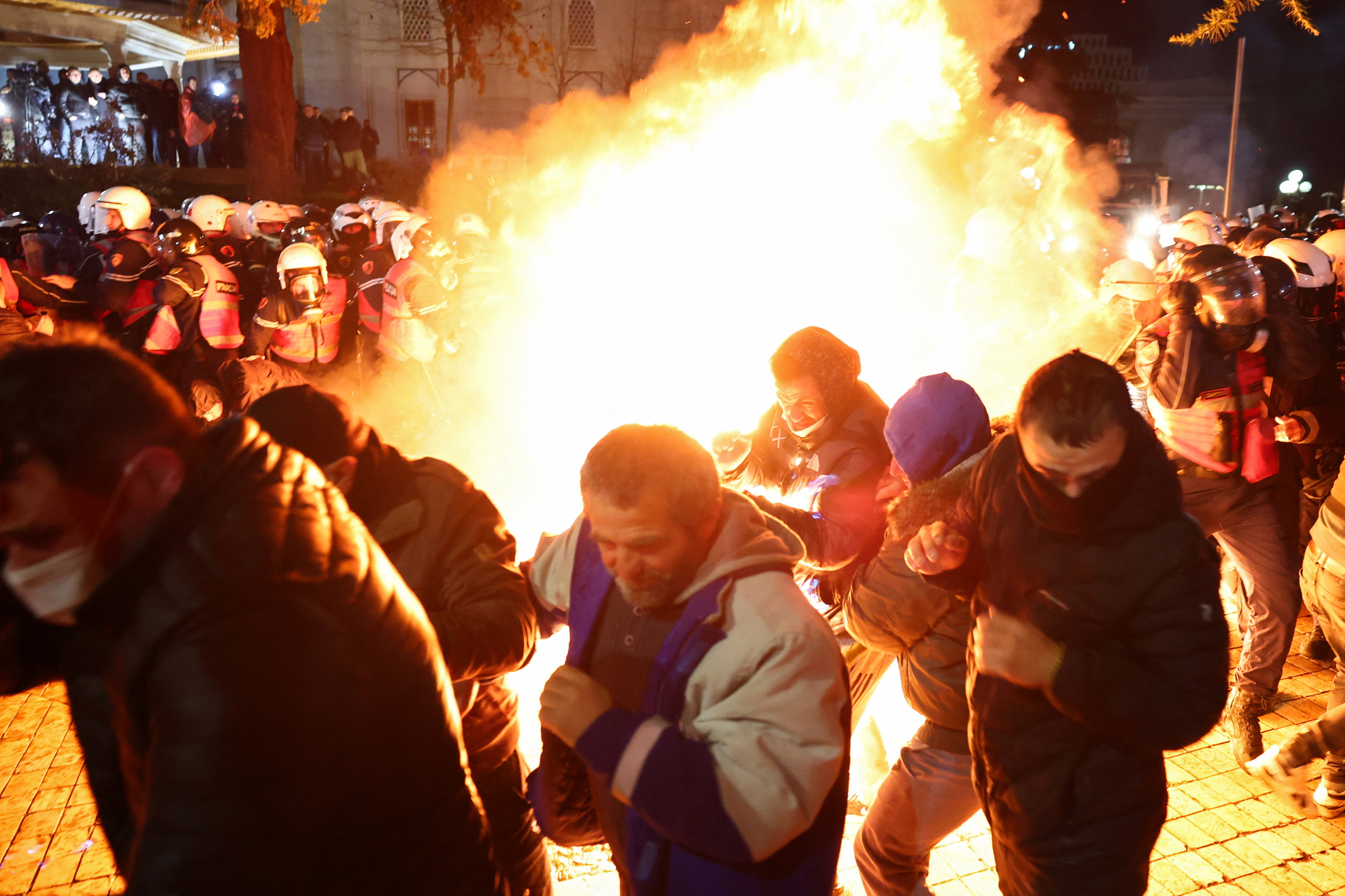 Protesters and police officers clash in front of the Parliament in Tirana, Albania, on February 10, 2026 [Florion Goga/Reuters]