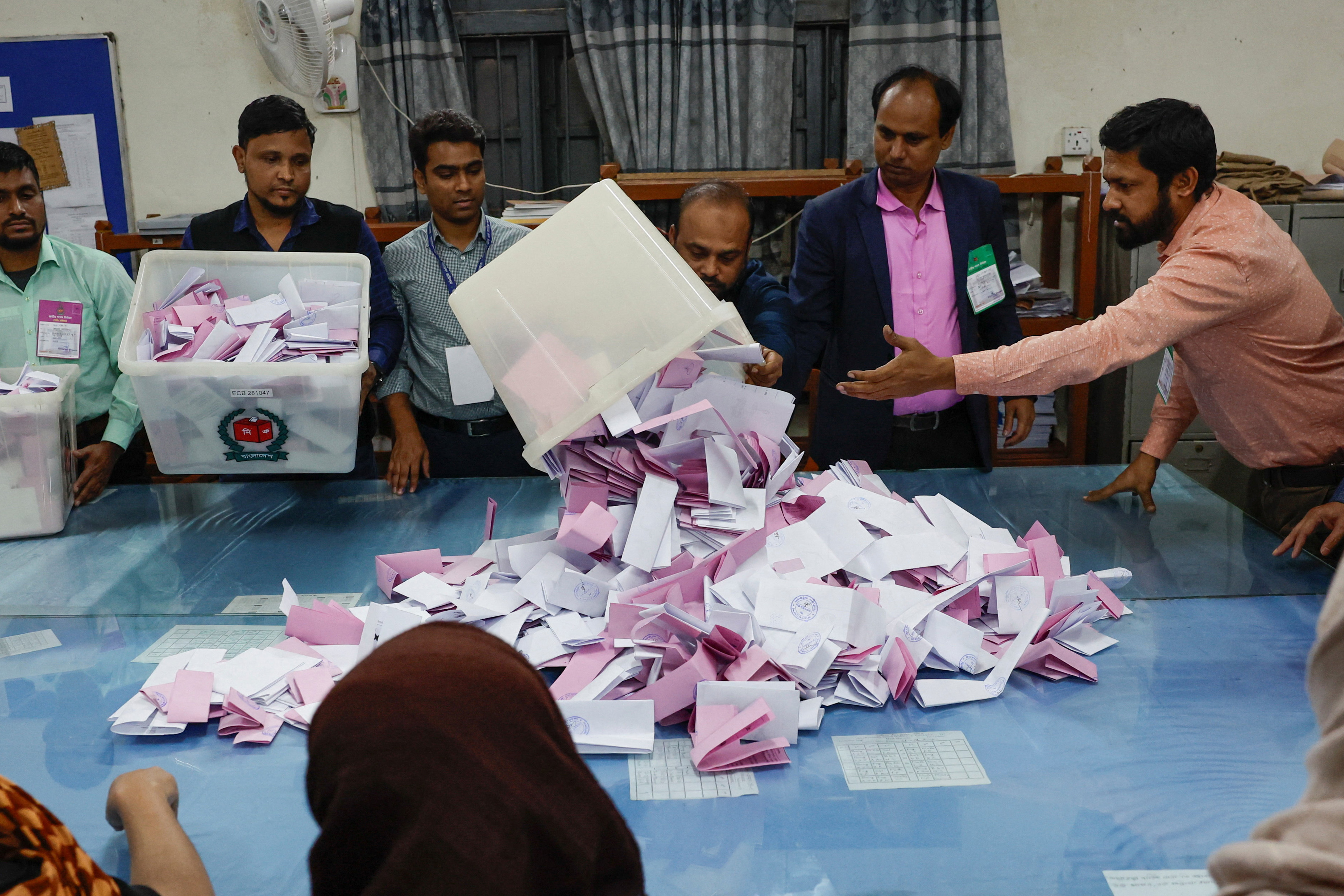 An electoral worker empties a ballot box as vote counting begins, during the 13th general election in Dhaka, Bangladesh, February 12, 2026. [Mohammad Ponir Hossain/Reuters]
