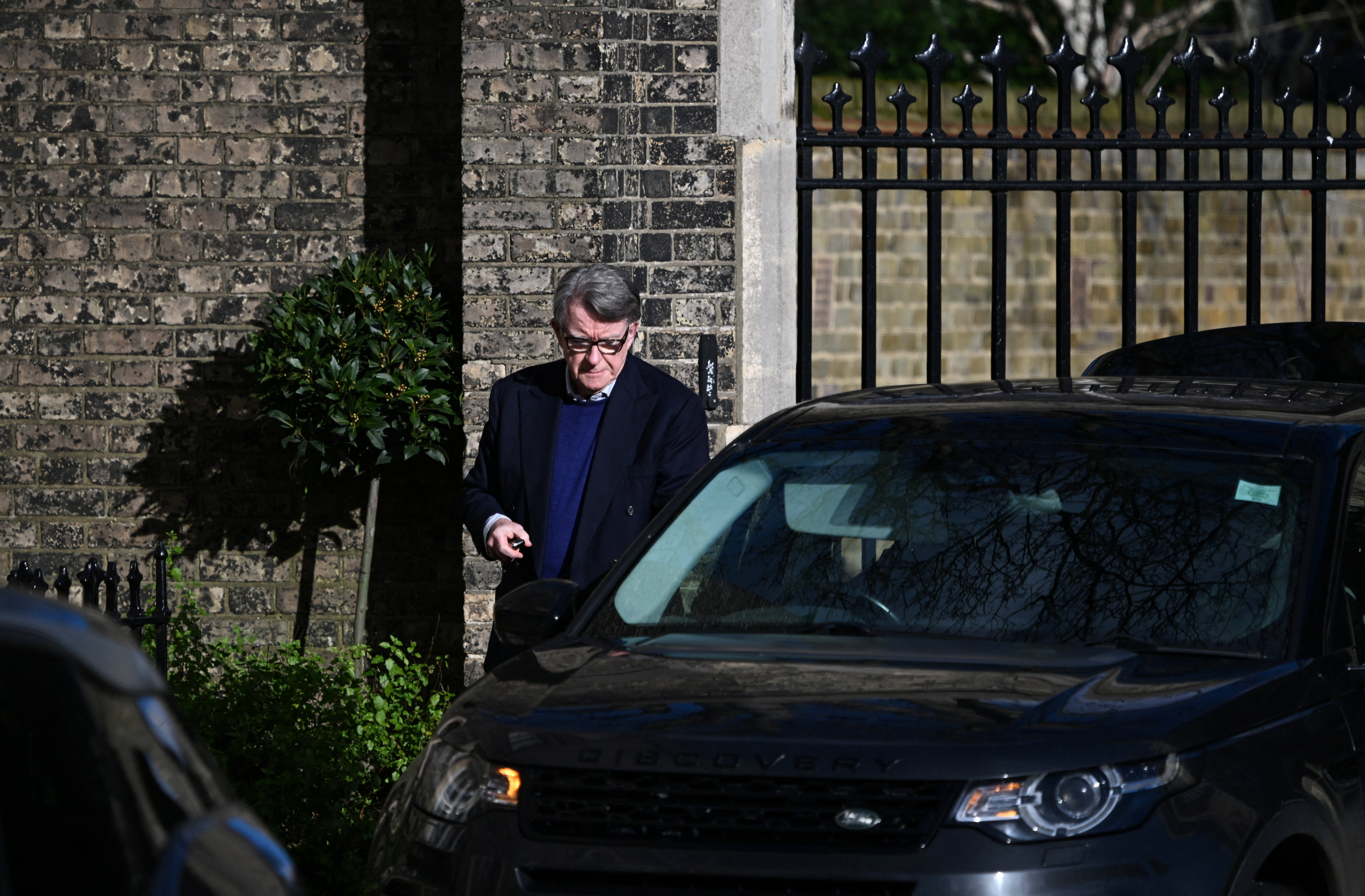 Former British Ambassador to the U.S. Peter Mandelson walks outside a reported residence, after police launched a misconduct in public office investigation following the release of U.S. Justice Department files linked to the late financier and convicted sex offender Jeffrey Epstein, in London, Britain, February 14, 2026. REUTERS/Chris Ratcliffe