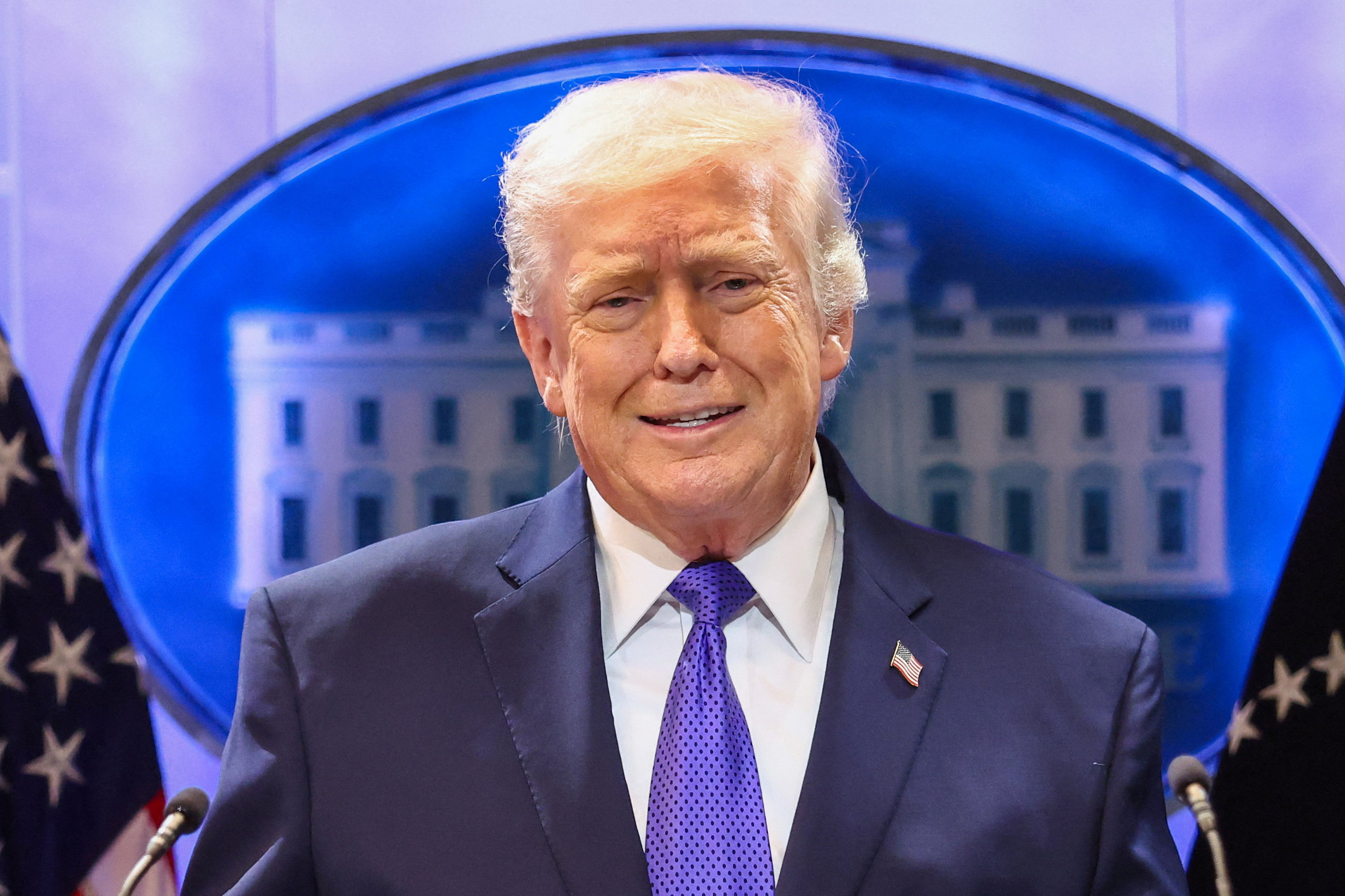 U.S. President Donald Trump gestures as he speaks during a press briefing at the White House