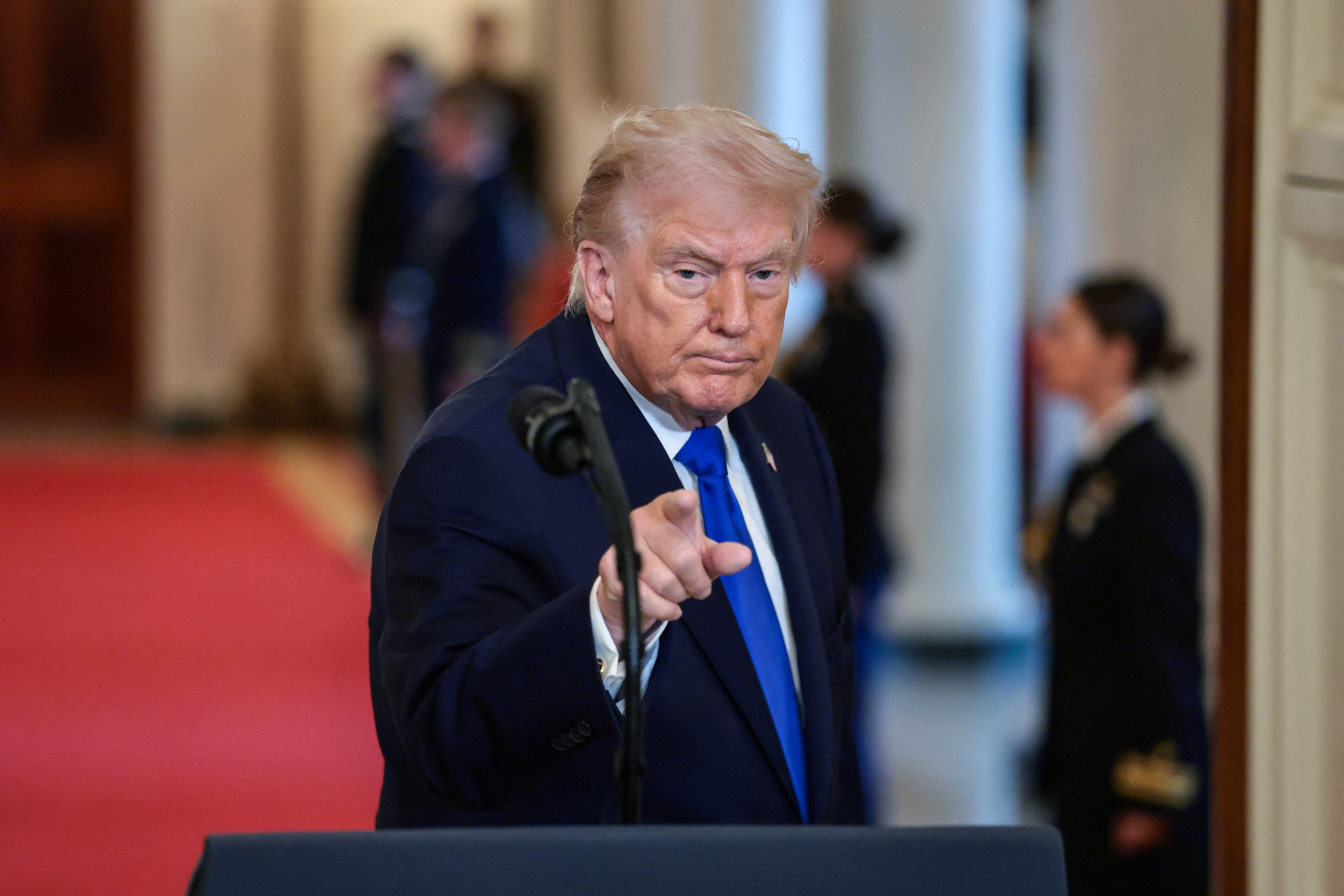 Gold prices, which are considered a safe investment during times of economic uncertainty surged to a three week high amid Trump's new tariff threat [Evelyn Hockstein/Reuters]