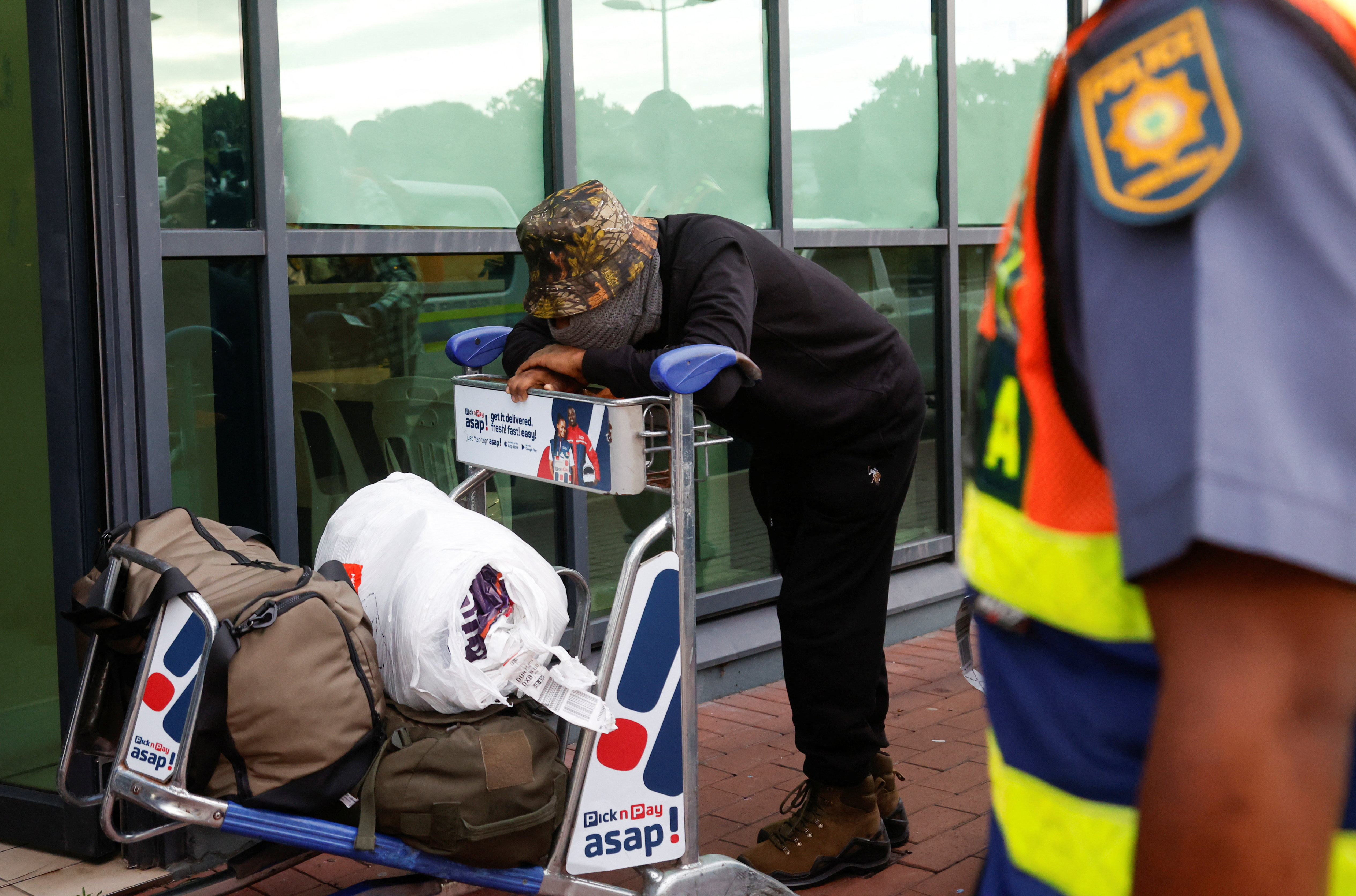 A South African man who was lured to fight in Russia's war on Ukraine arrive back home at King Shaka International Airport in Durban, South Africa, February 25, 2026. REUTERS/Rogan Ward