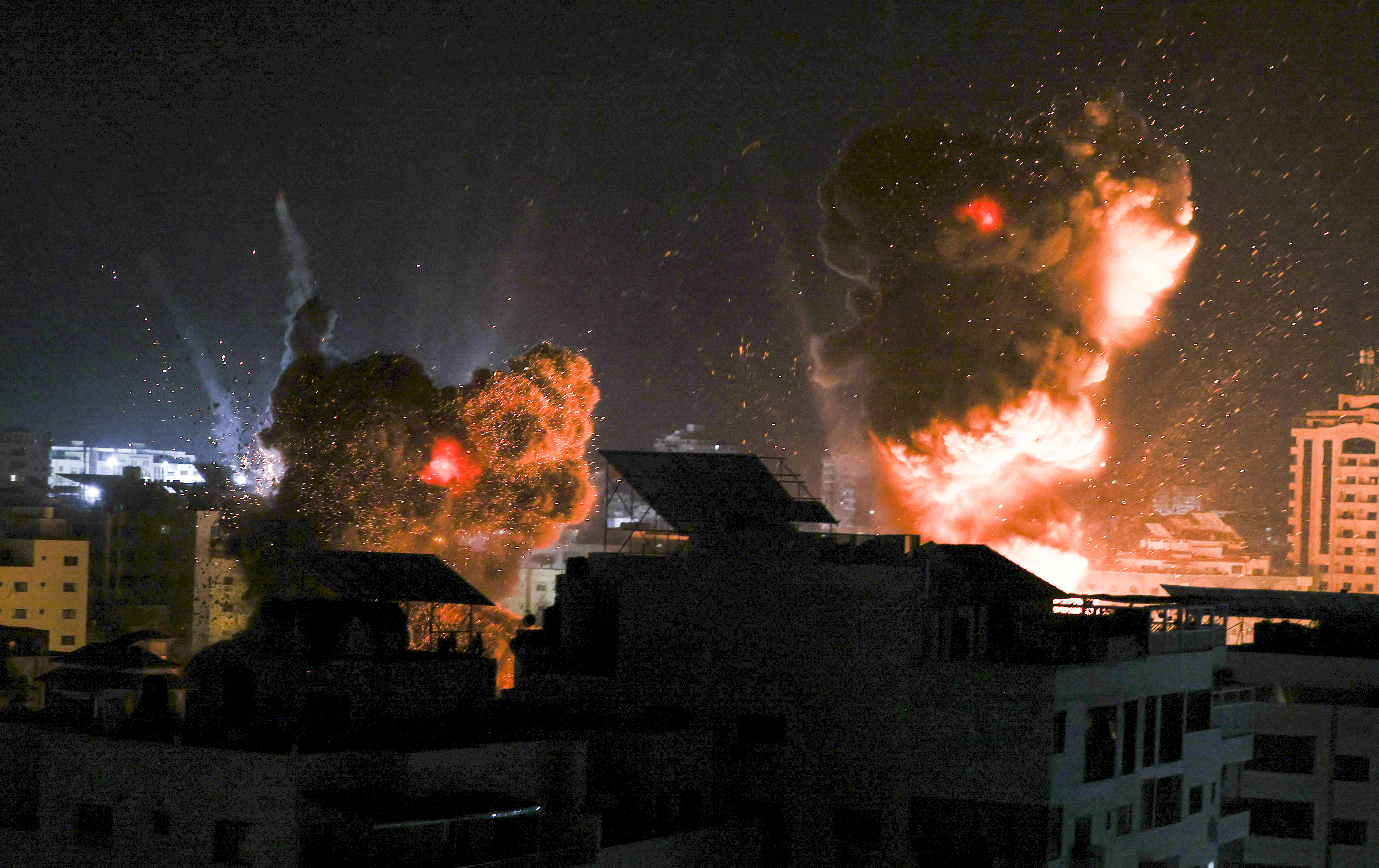 Explosions light-up the night sky
