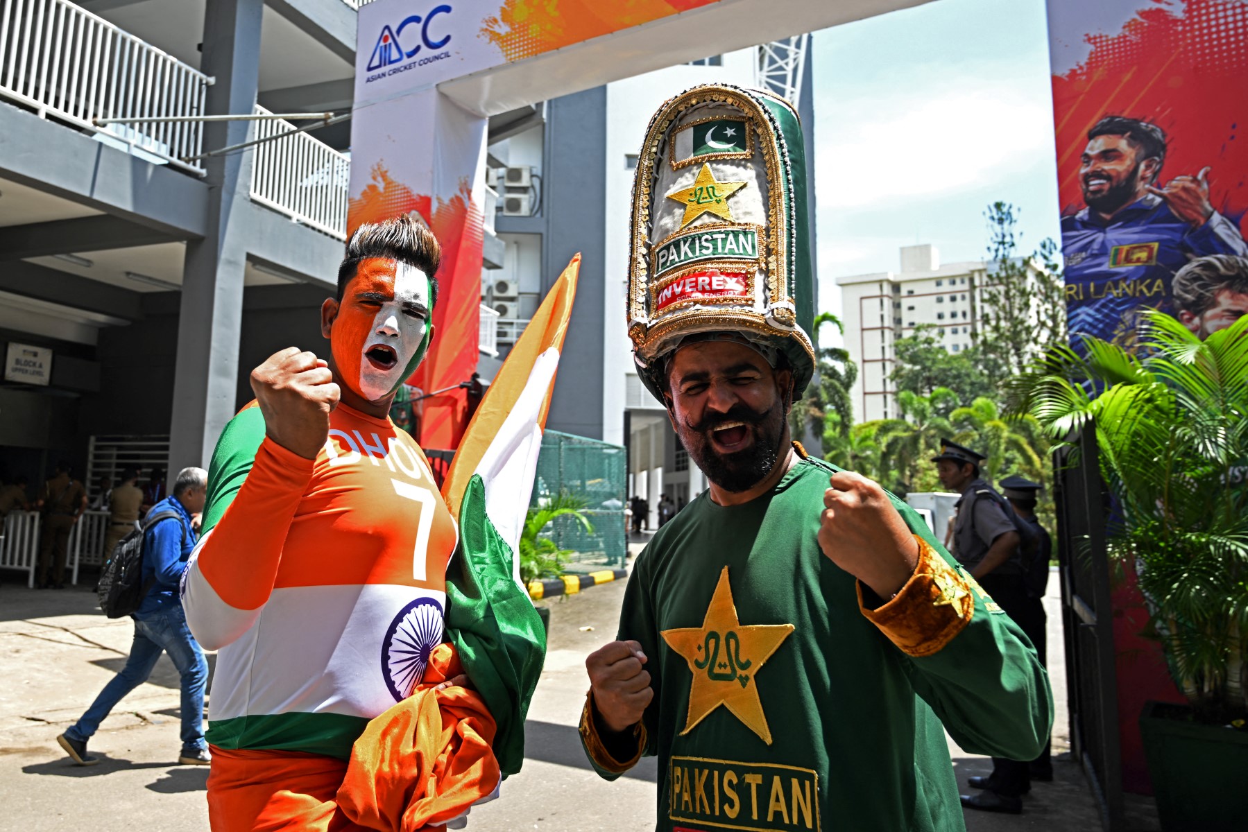 Fans cheer for India's and Pakistan's team as they arrive to watch the Asia Cup 2023 super four one-day international (ODI) cricket match between India and Pakistan at the R. Premadasa Stadium in Colombo on September 10, 2023. (Photo by FAROOQ NAEEM / AFP)