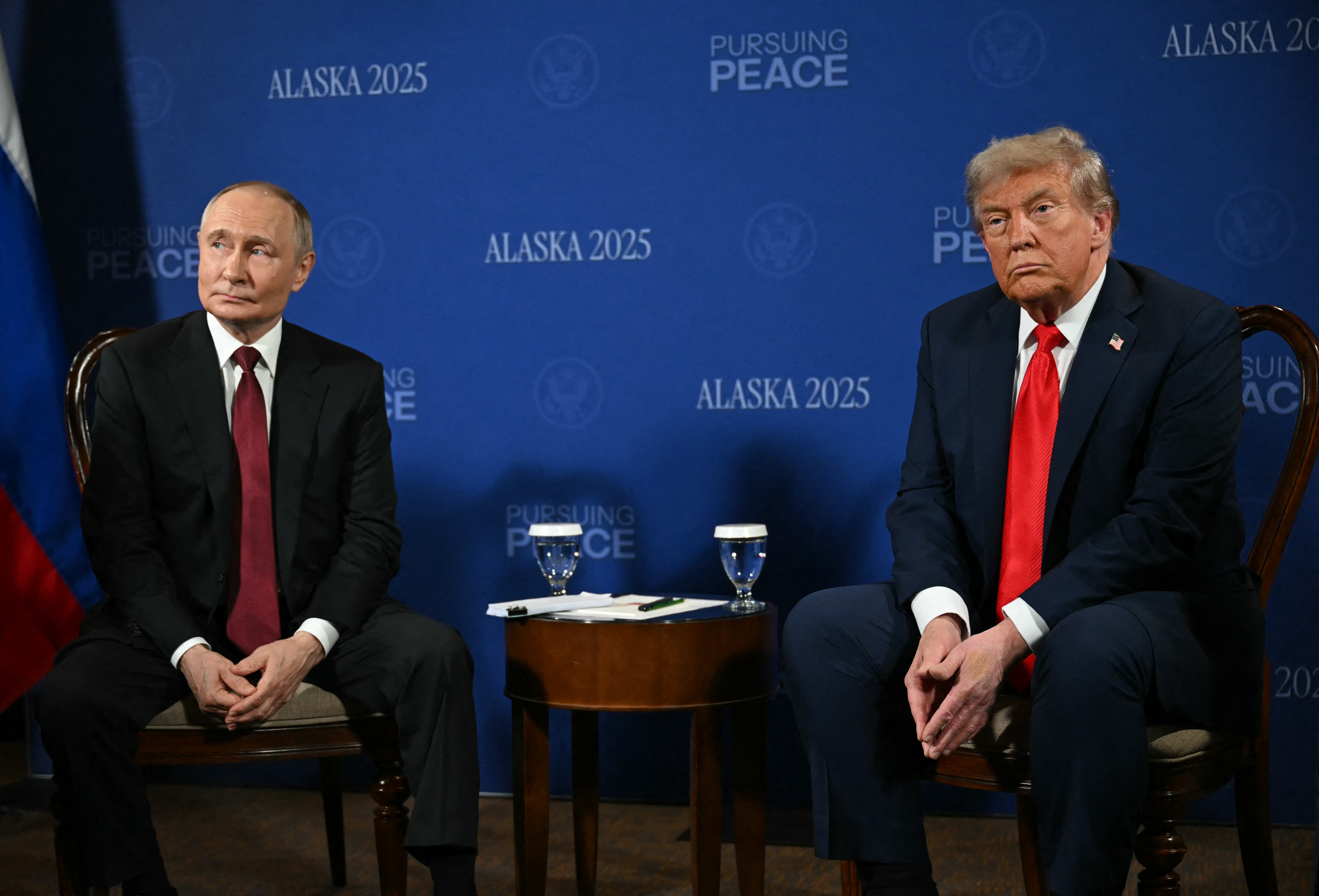 US President Donald Trump and Russian President Vladimir Putin meet during a US-Russia summit on Ukraine at Joint Base Elmendorf-Richardson in Anchorage, Alaska, on August 15, 2025. (Photo by ANDREW CABALLERO-REYNOLDS / AFP)