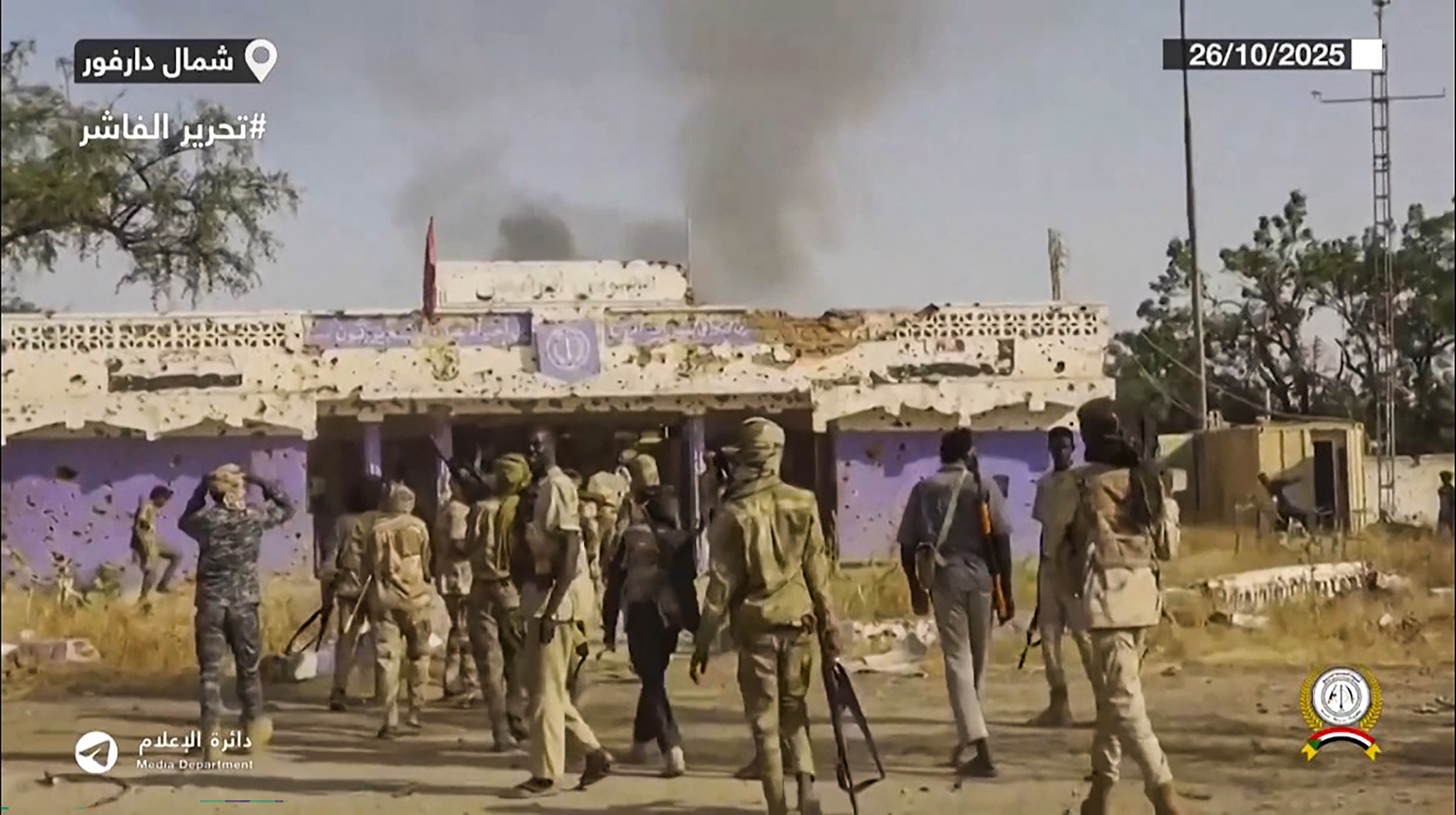 This image grab taken from handout video footage released on Sudan's paramilitary Rapid Support Forces (RSF) Telegram account on October 26, 2025, shows RSF fighters holding weapons and celebrating in the streets of El-Fasher in Sudan's Darfur. The governor of Darfur, allied with the Sudanese army, on October 27, 2025, called for the "protection of civilians" in the famine-stricken city of El-Fasher, after the paramilitary Rapid Support Forces (RSF) claimed to have taken control. (Photo by Rapid Support Forces (RSF) / AFP) / === RESTRICTED TO EDITORIAL USE - MANDATORY CREDIT "AFP PHOTO / HO / SUDAN RAPID SUPPORT FORCES (RSF) TELEGRAM ACCOUNT" - NO MARKETING NO ADVERTISING CAMPAIGNS - DISTRIBUTED AS A SERVICE TO CLIENTS ===