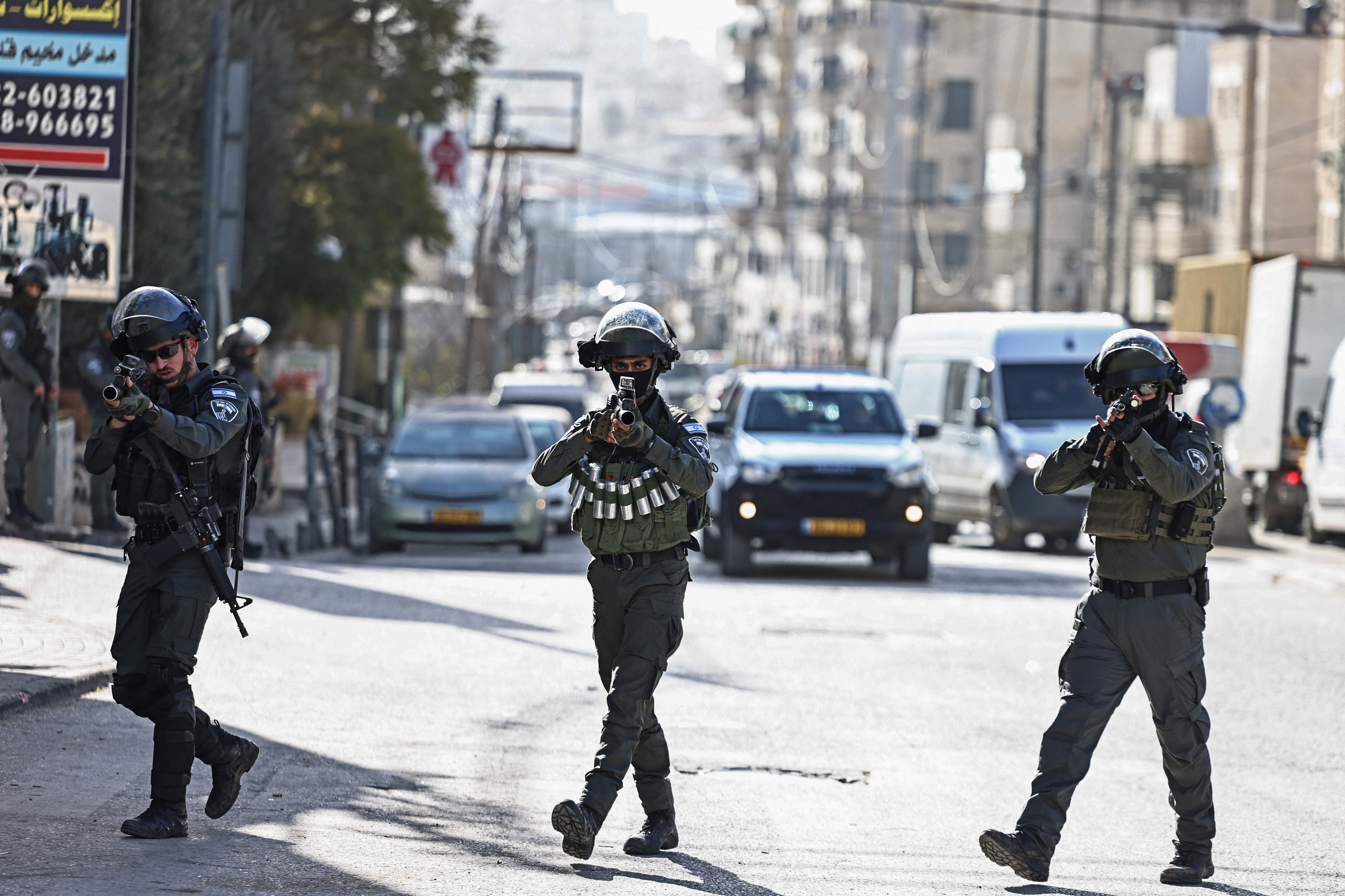Israeli forces patrol along a street during a military raid in the neighbourhood of Kafr Aqab near Ramallah, in the occupied West Bank