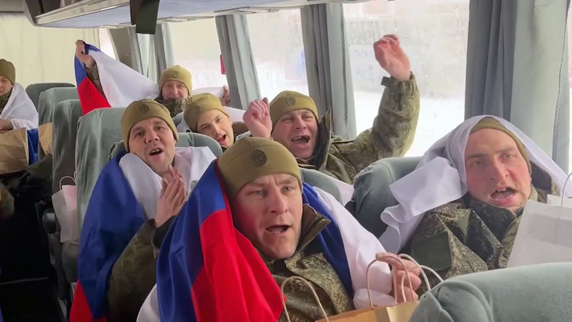 Russian prisoners of war (POWs) reacting in a bus