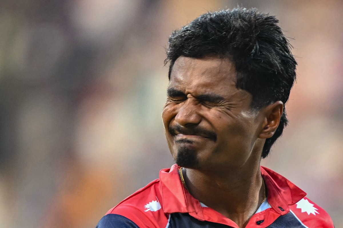 Nepal's captain Rohit Paudel reacts as he walks back to the pavilion after his dismissal during the 2026 ICC Men's T20 Cricket World Cup group stage match between England and Nepal at the Wankhede Stadium in Mumbai on February 8, 2026. (Photo by Indranil MUKHERJEE / AFP)