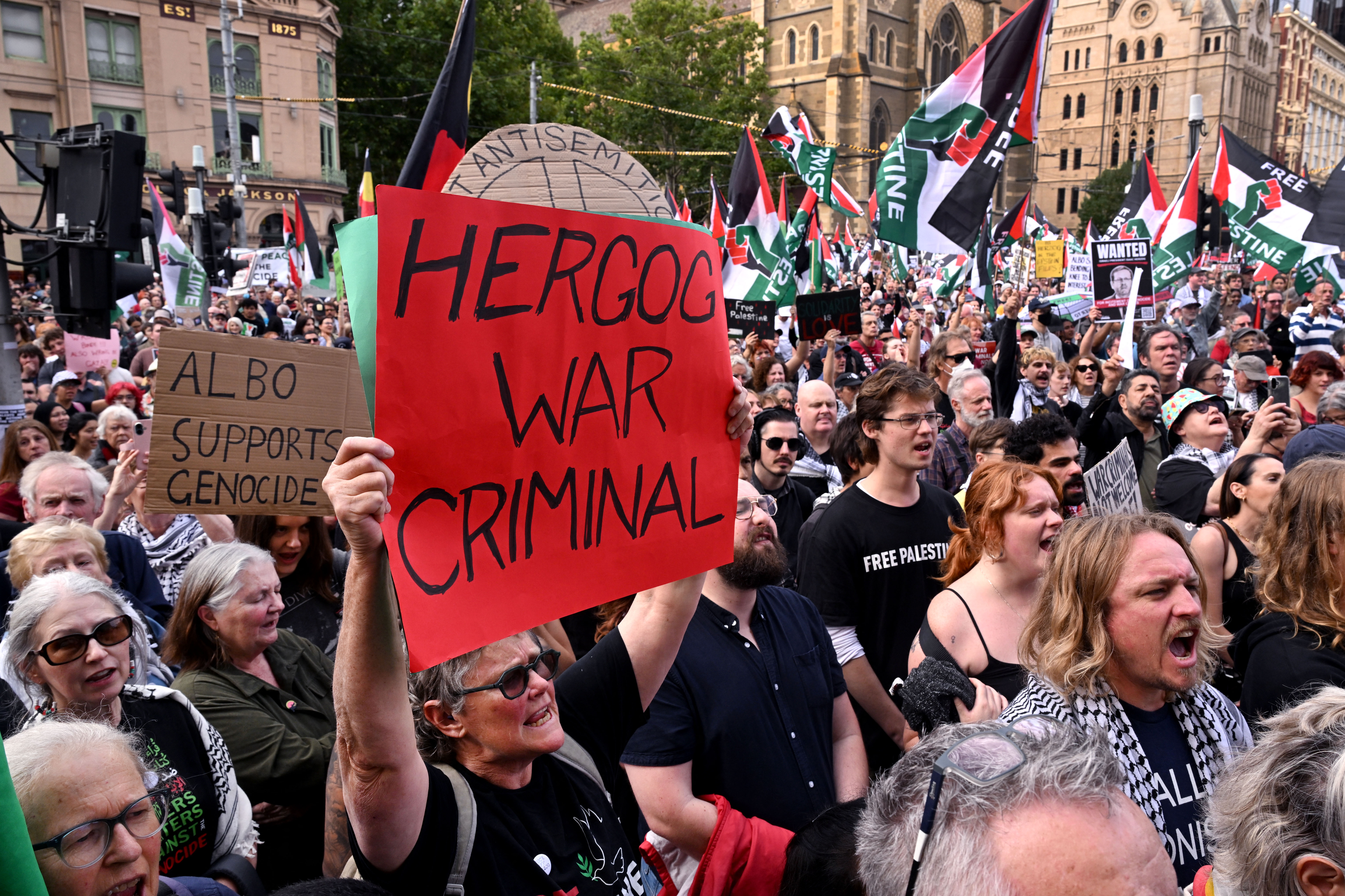 Palestine supporters take part in a protest rally against a state visit by Israeli President Isaac Herzog, in Melbourne