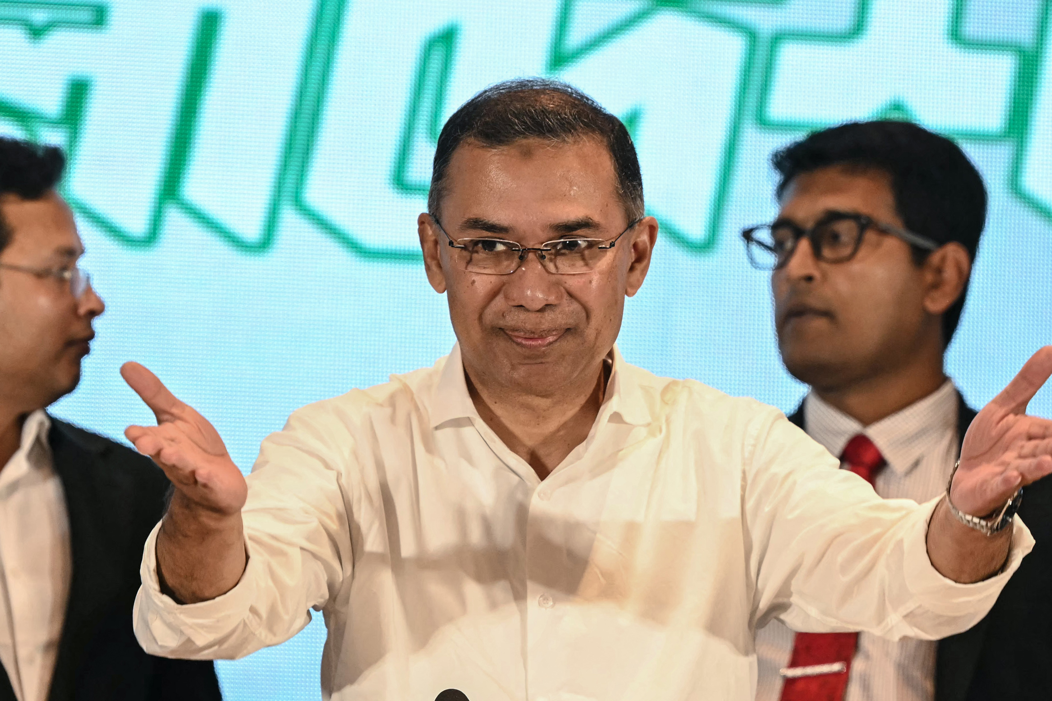 Bangladesh Nationalist Party (BNP) chairman Tarique Rahman (C) gestures as he arrives to address a press conference in Dhaka on February 14, 2026. [Sajjad Hussain/AFP]