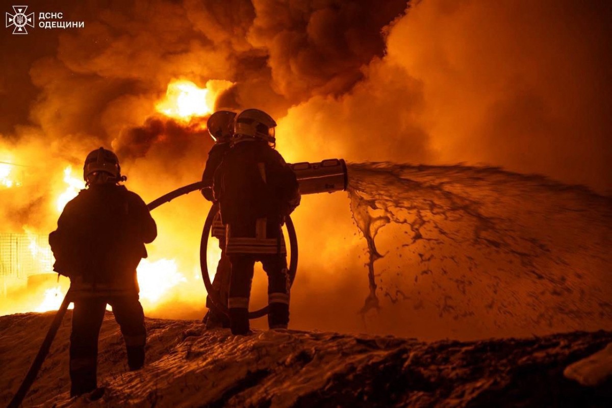 This photograph taken and released by Ukrainian Emergency Services on February 15, 2026 shows firefighters extinguishing a fire after a Russian drone strike in Odessa, amid the Russian invasion of Ukraine. (Photo by Handout / UKRAINIAN EMERGENCY SERVICE / AFP) / RESTRICTED TO EDITORIAL USE - MANDATORY CREDIT "AFP PHOTO / UKRAINIAN EMERGENCY SERVICE" - NO MARKETING NO ADVERTISING CAMPAIGNS - DISTRIBUTED AS A SERVICE TO CLIENTS