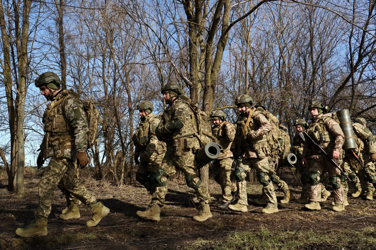 In this handout photograph taken and released by the press service of the 65th Mechanized Brigade of Ukrainian Armed Forces on February 22, 2026, Ukrainian recruits complete basic military training at an undisclosed location in Zaporizhzhia region, amid the Russian invasion of Ukraine. (Photo by Andriy Andriyenko / 65th Mechanized Brigade of Ukrainian Armed Forces / AFP) / RESTRICTED TO EDITORIAL USE - MANDATORY CREDIT "AFP PHOTO / ANDRIY ANDRIYENKO / 65TH MECANIZED BRIGADE OF UKRAINE ARMED FORCES" - HANDOUT - NO MARKETING NO ADVERTISING CAMPAIGNS - DISTRIBUTED AS A SERVICE TO CLIENTS - AFP CANNOT INDEPENDENTLY VERIFY THE AUTHENTICITY OR LOCATION, DATE, AND CONTENT OF THESE IMAGES.