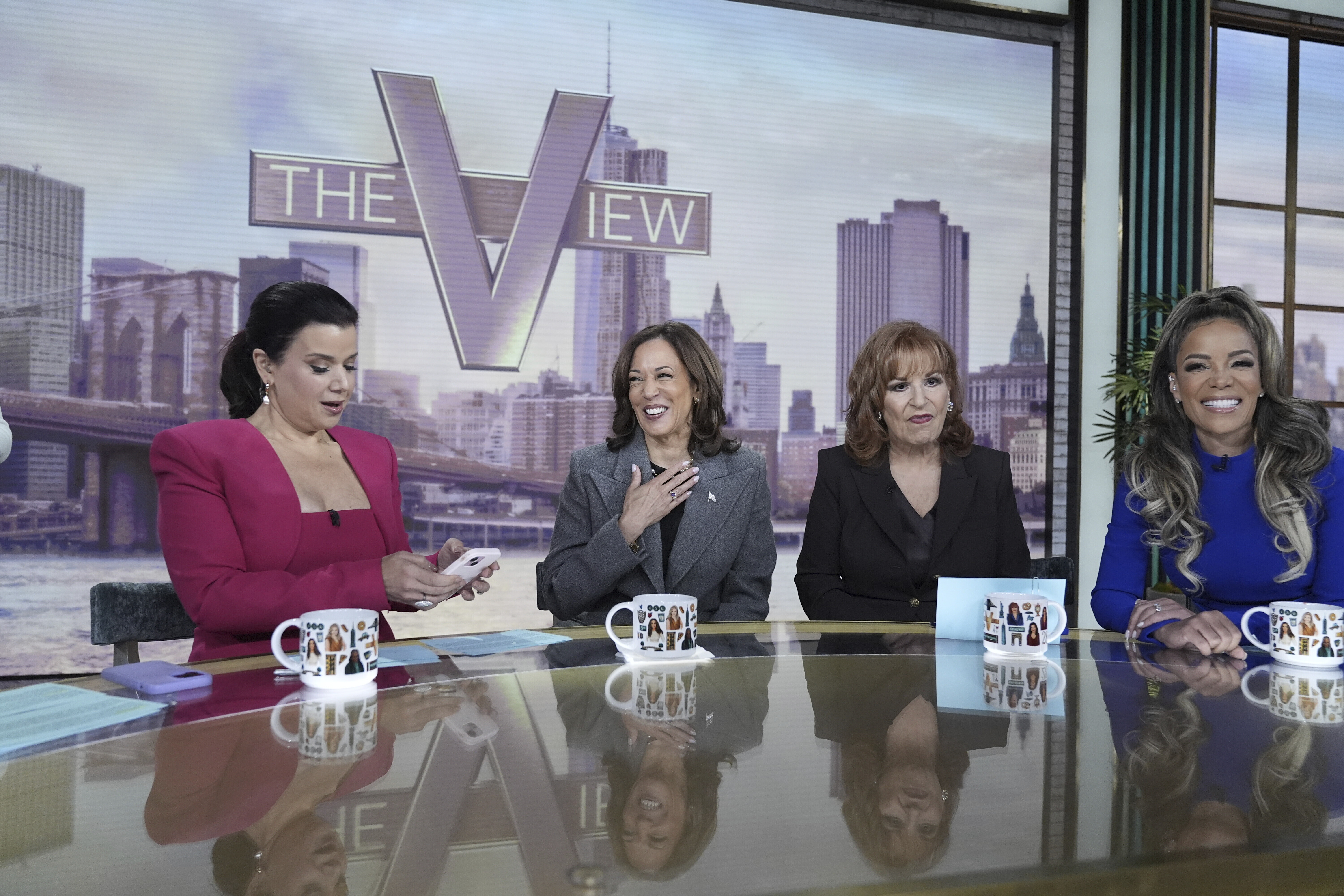 Democratic presidential nominee Vice President Kamala Harris chats with the hosts during a commercial break at The View, Tuesday, Oct. 8, 2024, in New York in USA