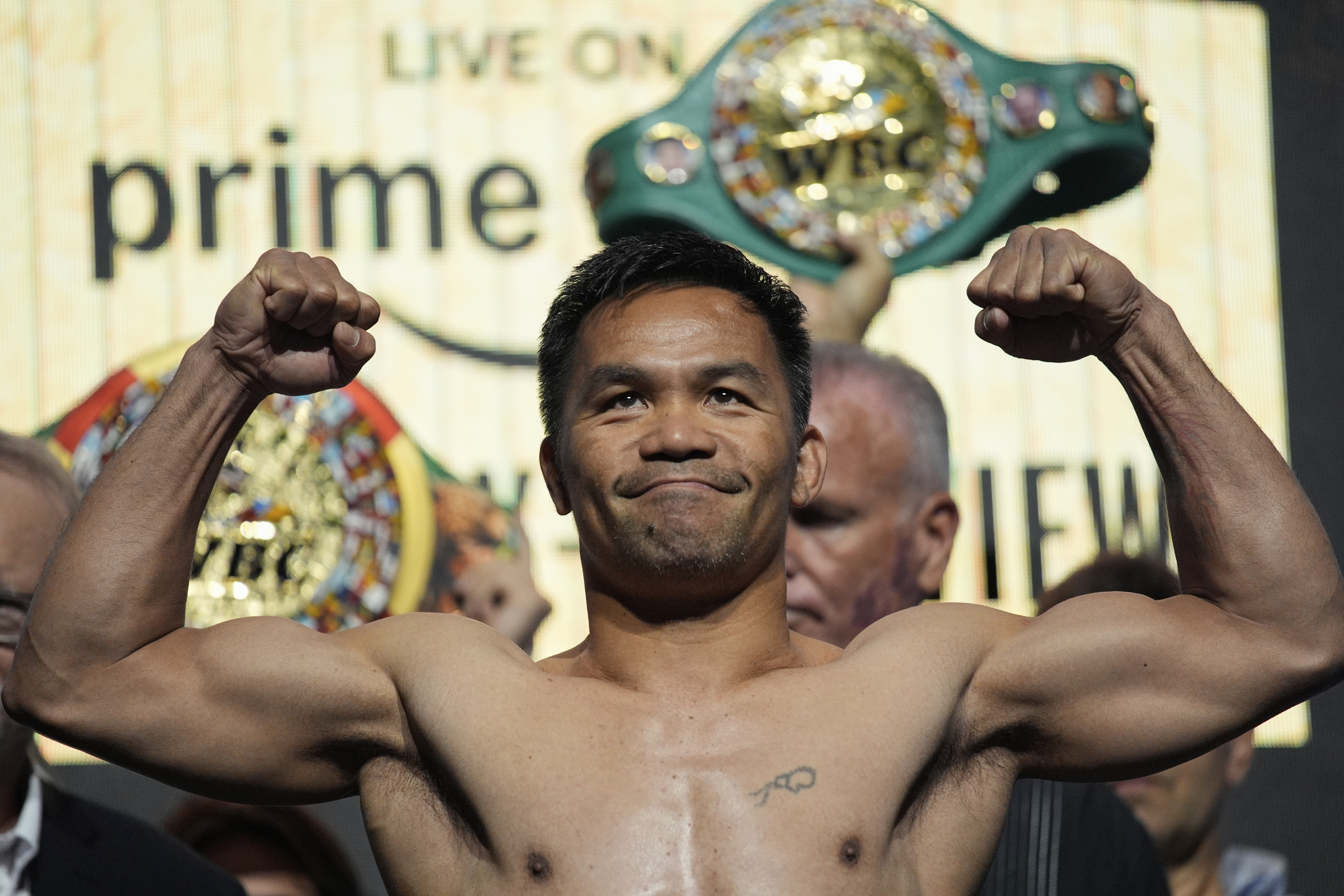 Manny Pacquiao poses on the scale during a ceremonial weigh-in.