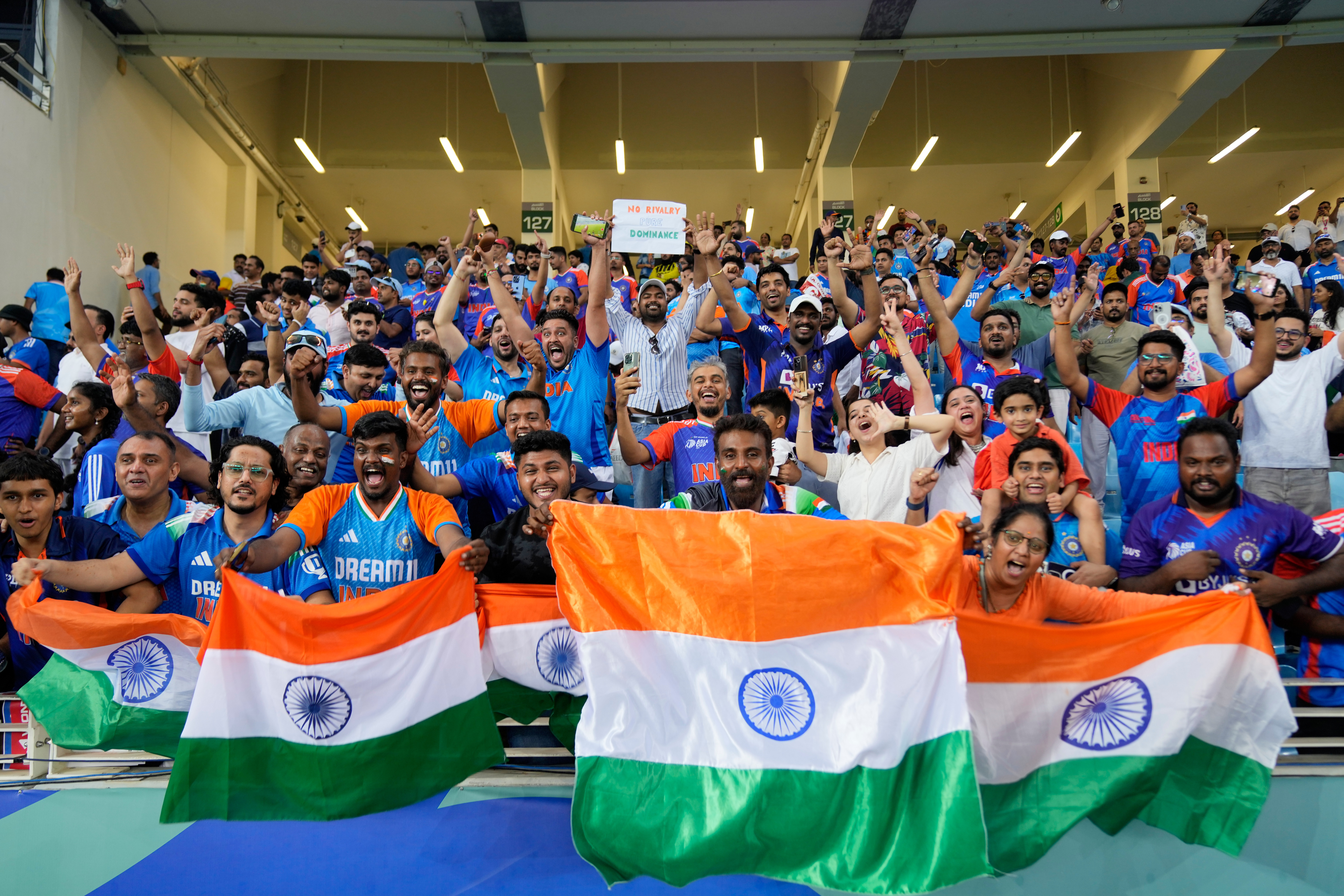 Fans celebrate after India won the Asia Cup cricket final against Pakistan at Dubai International Cricket Stadium, United Arab Emirates, Sunday, Sept. 28, 2025. (AP Photo/Altaf Qadri)