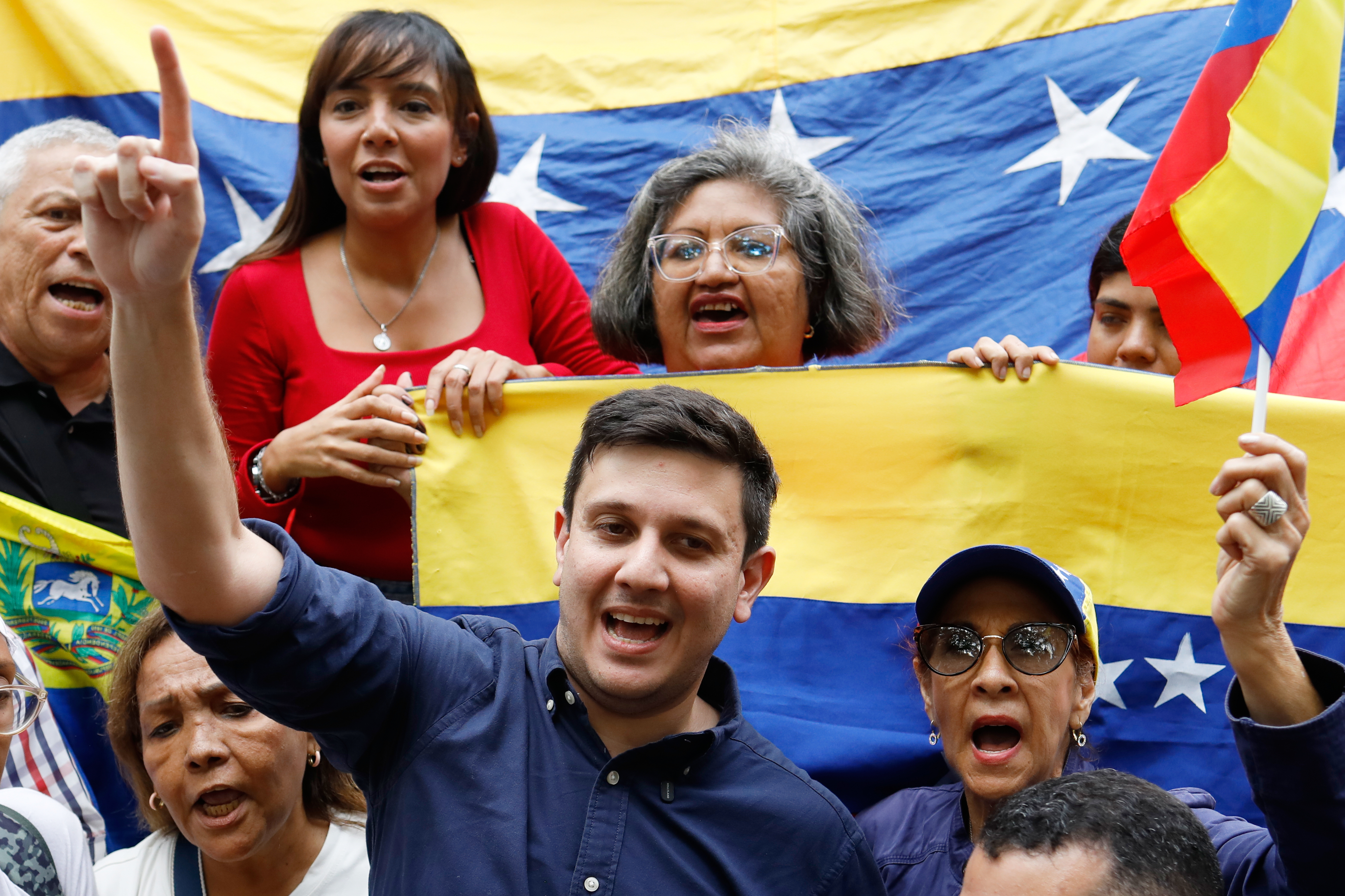 Jesus Armas celebrates in front of Venezuelan flags