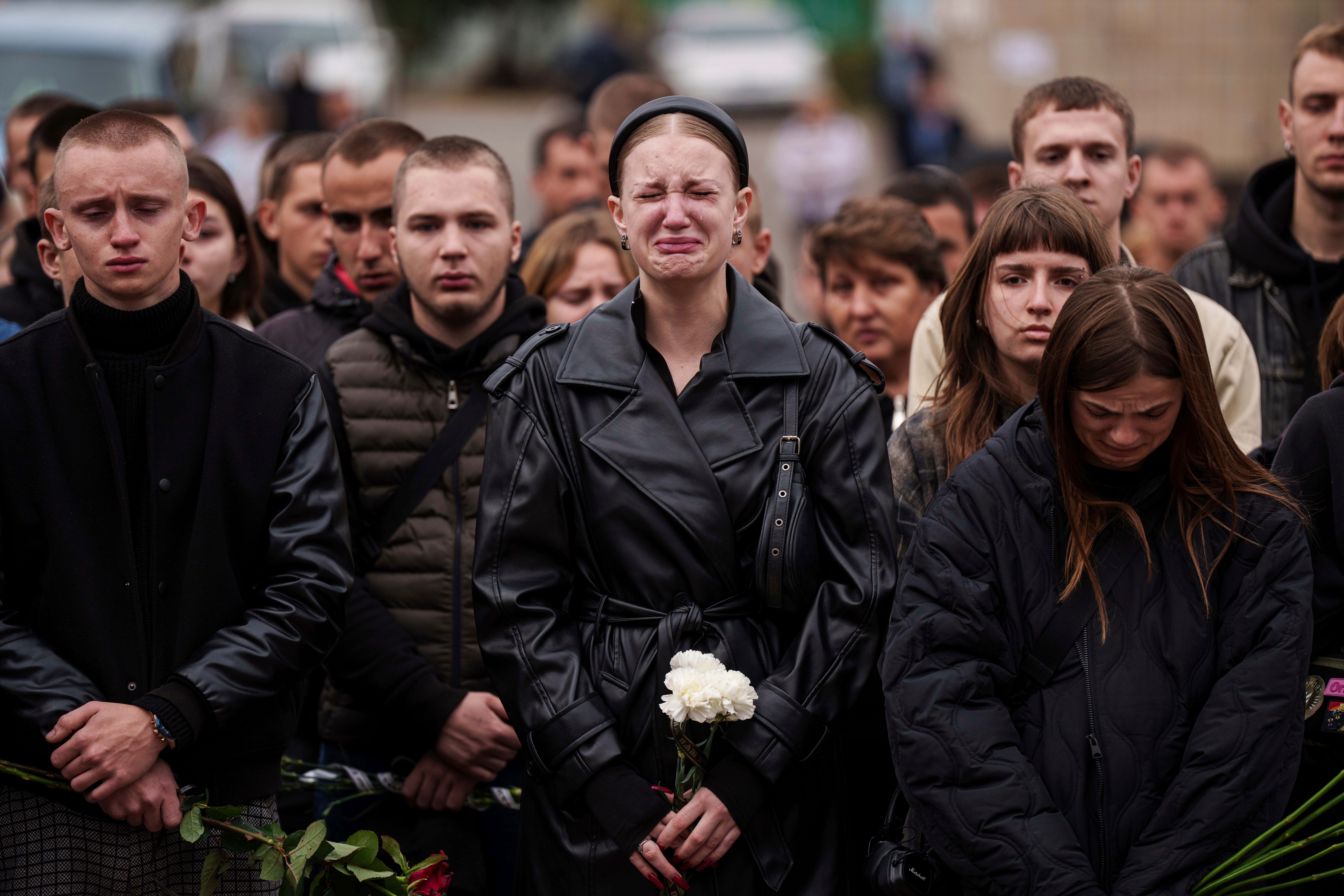 A woman cries during the funeral ceremony of Ihor Kusochek, a Ukrainian soldier of the Azov brigade in Bobrovytsia, Chernihiv region