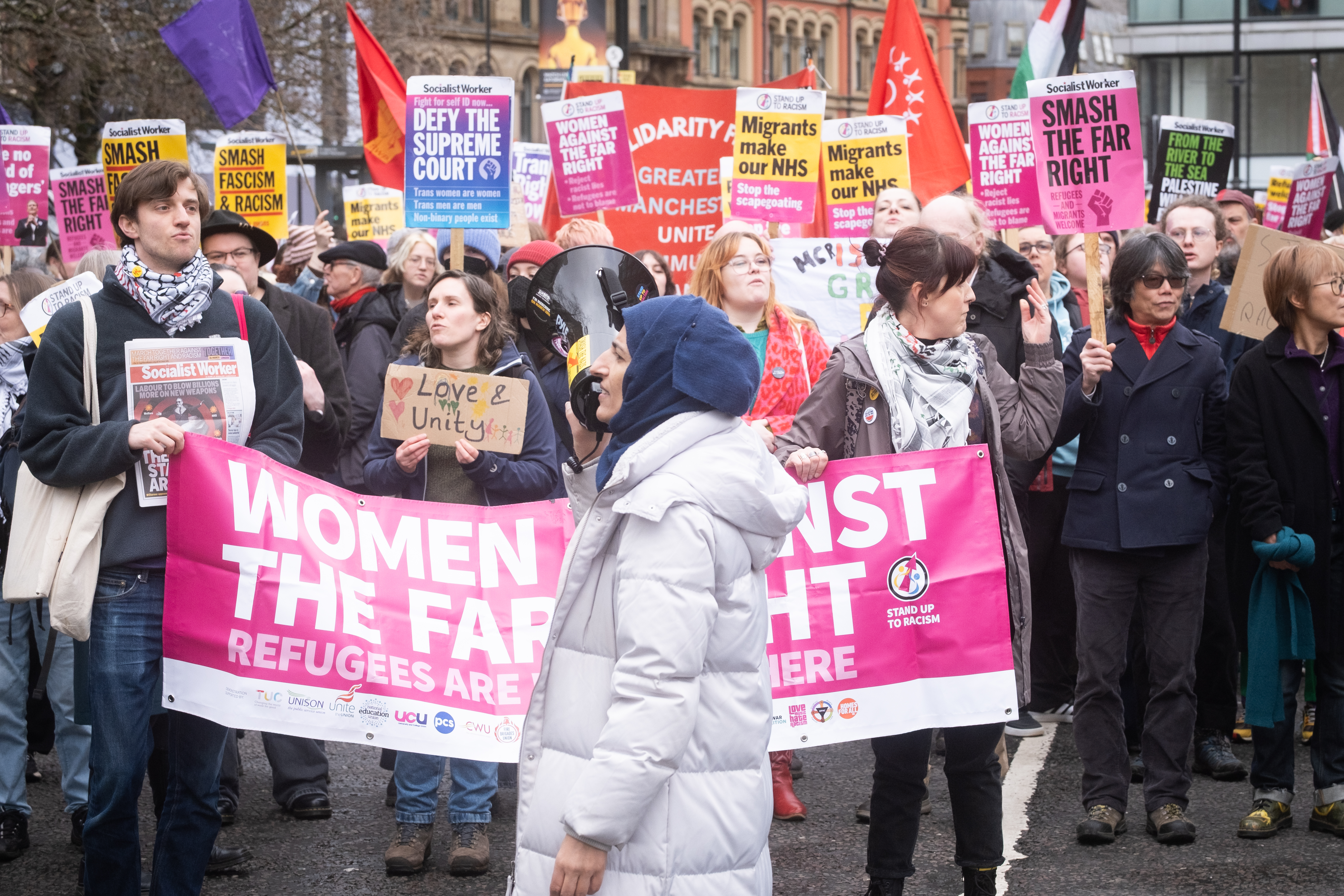 People take part in a 'Stop Britain First- no place for fascists' unity event opposing Britain First's 'march