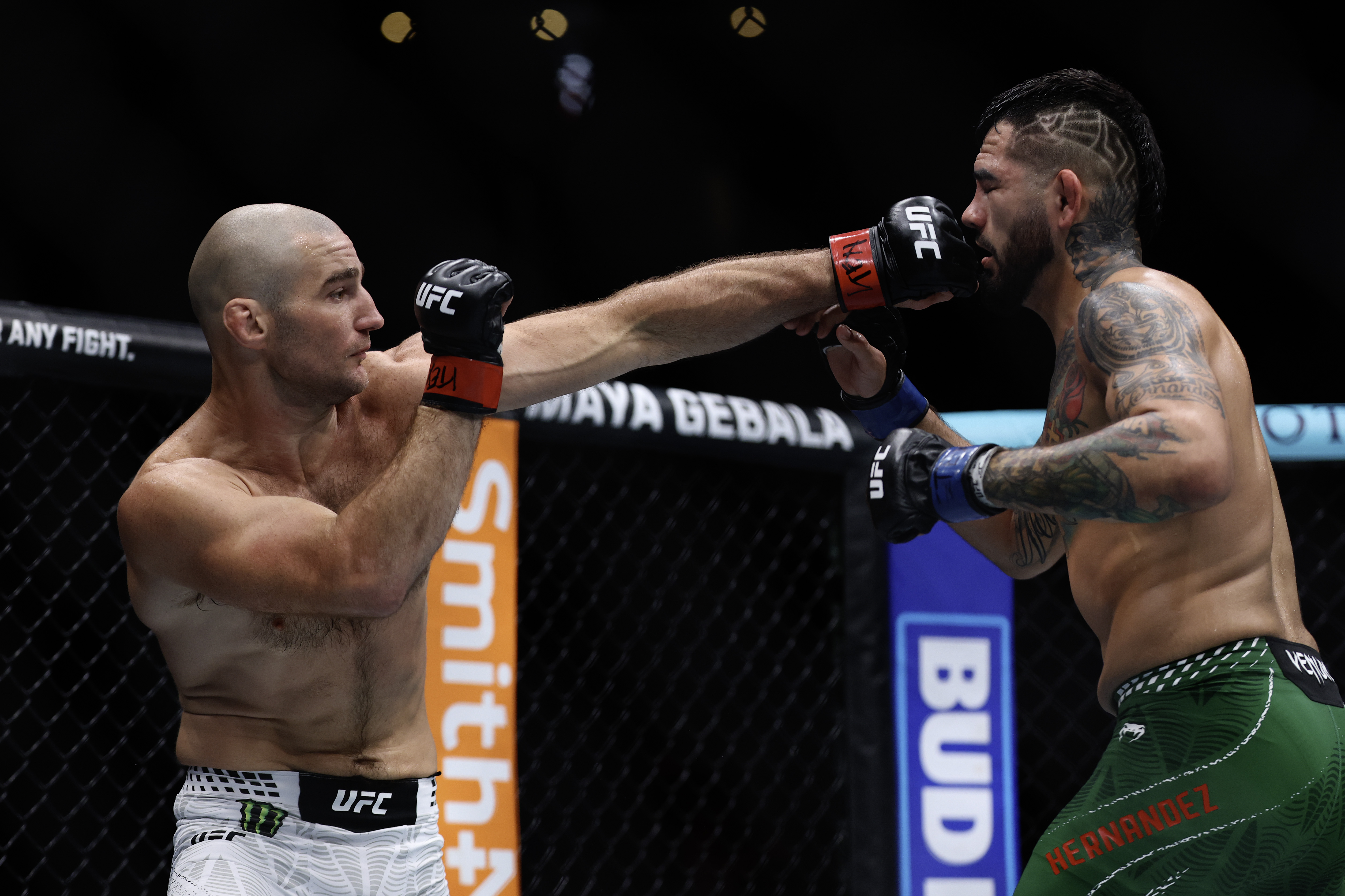 Sean Strickland and Anthony Hernandez in action.