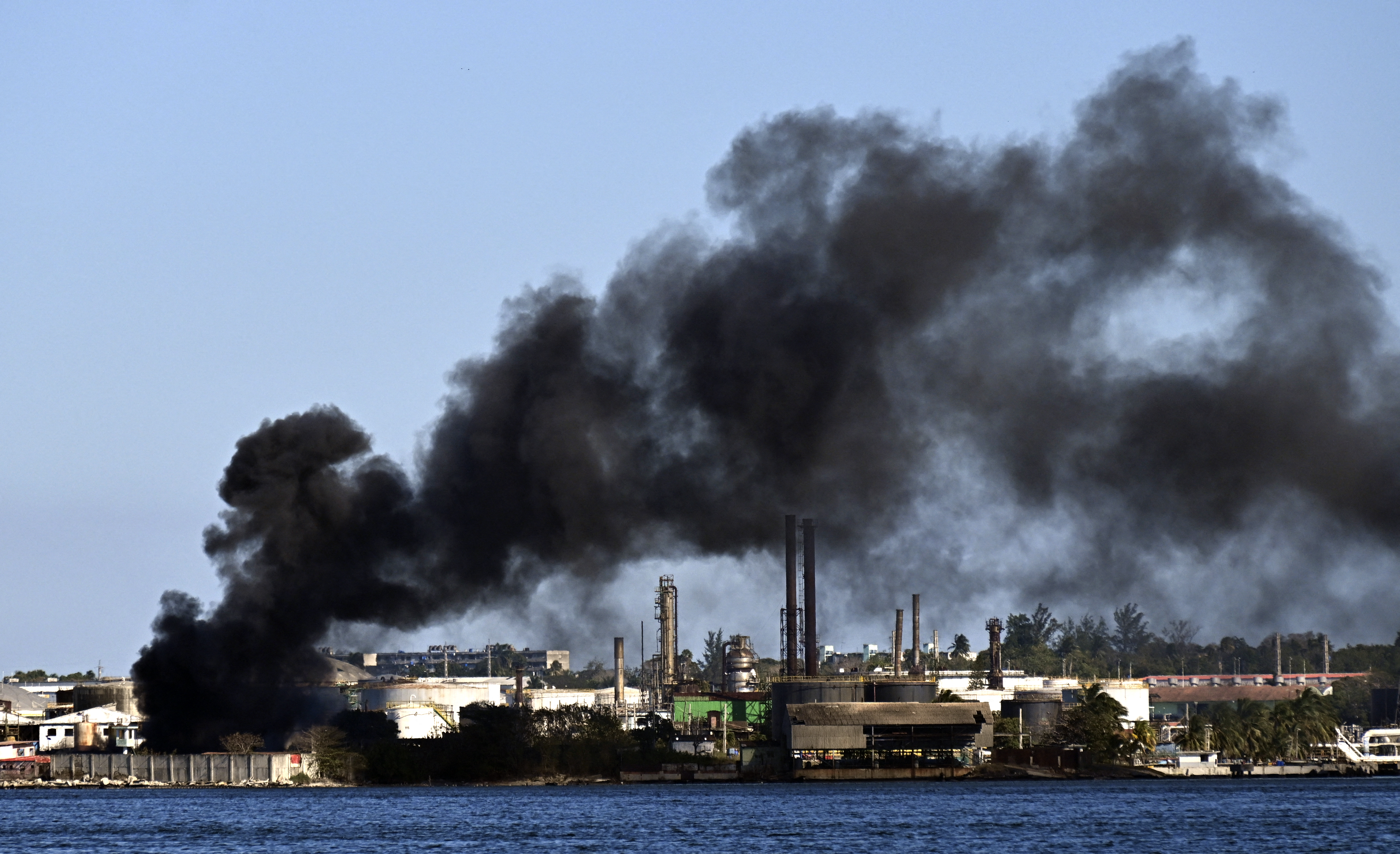 Black smoke billows from a fire at the Nico Lopes oil refinery in Havana on February 13, 2026.