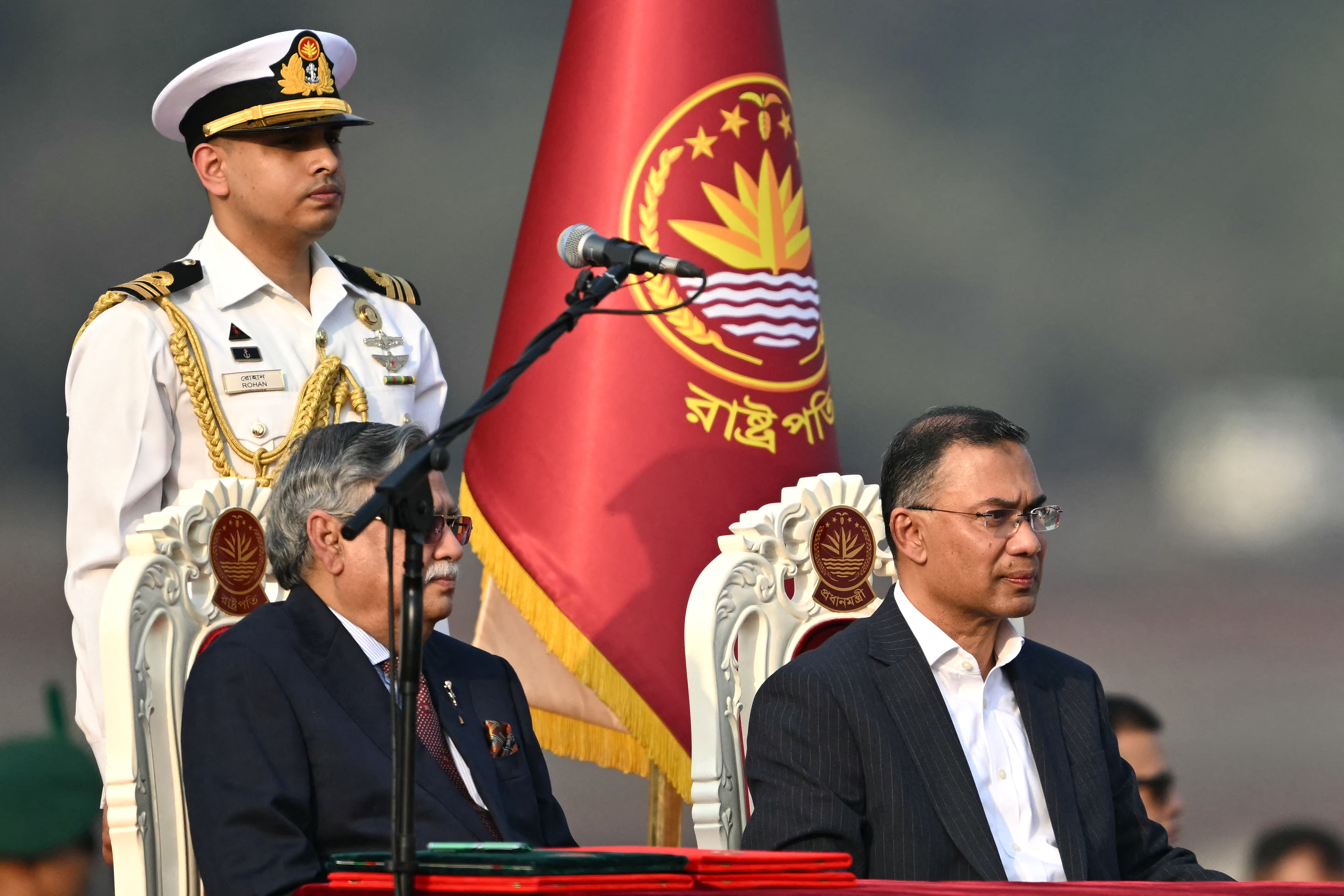 Bangladesh's newly sworn-in Prime minister Tarique Rahman (R) looks on after taking oath during a swearing-in ceremony at the National Parliament building in Dhaka on February 17, 2026.