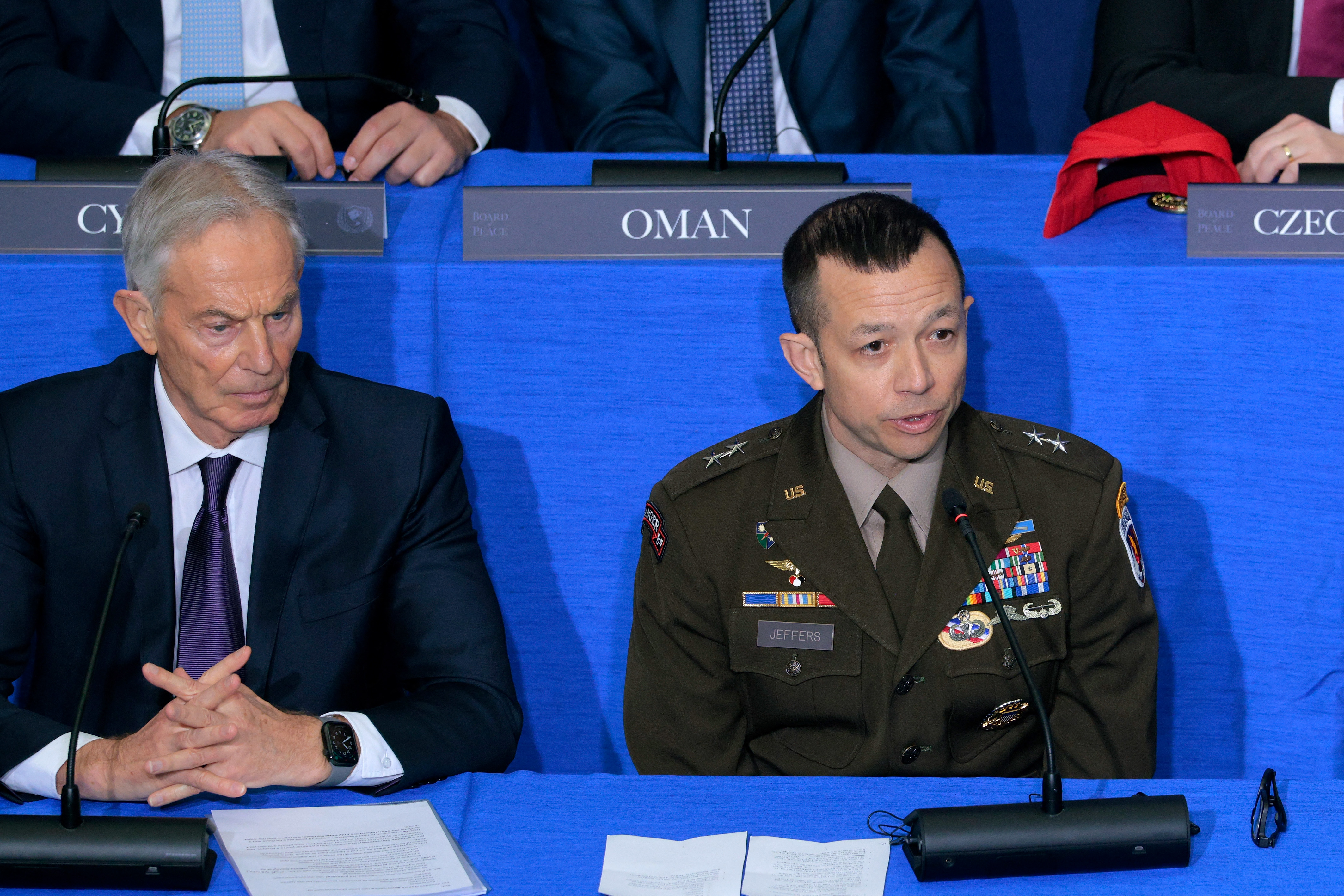ISF Commander Major-General Jasper Jeffers (R) speaks as former UK Prime Minister Tony Blair listens during inaugural meeting.