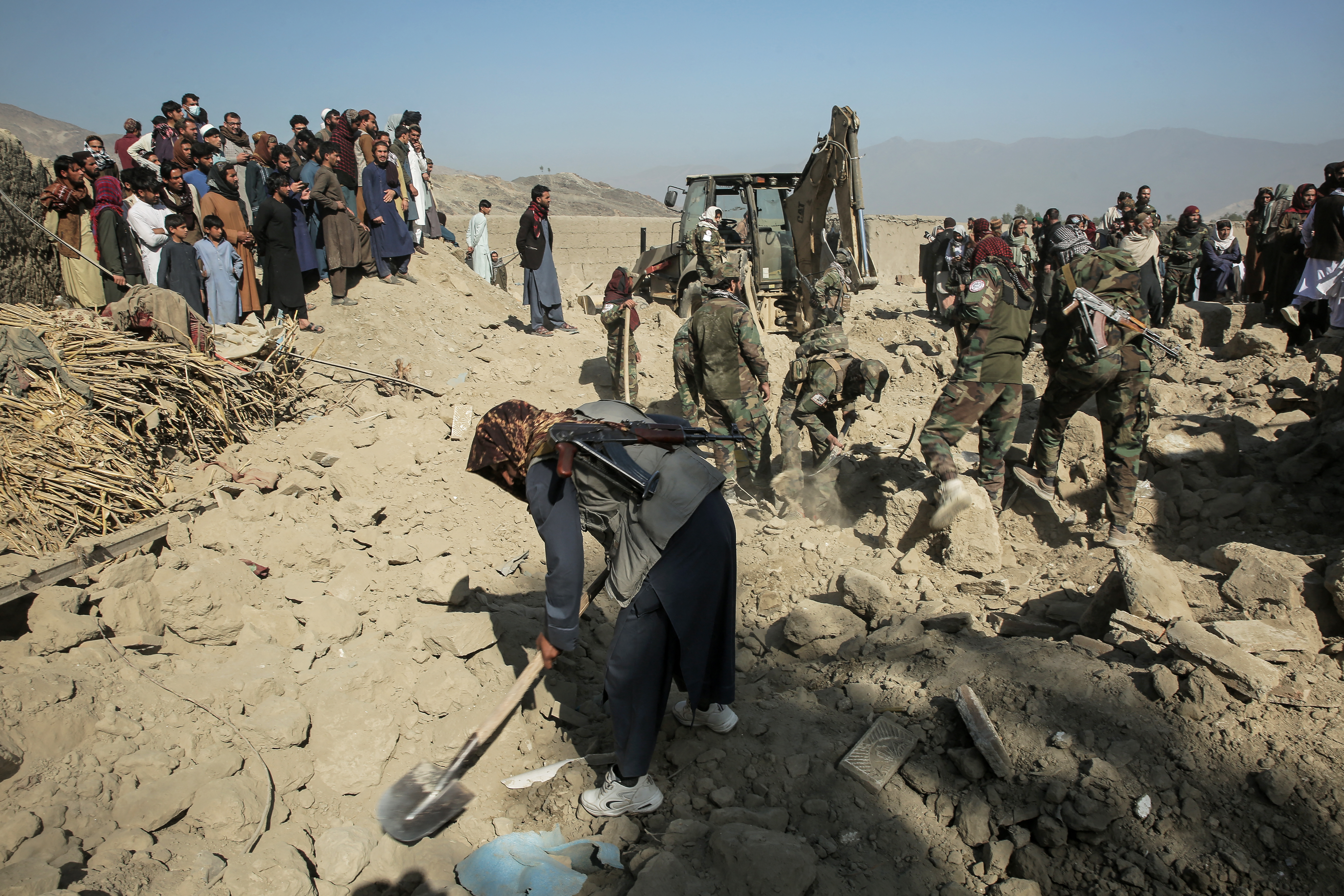 Taliban security personnel search for victims after an overnight Pakistani air strike hit