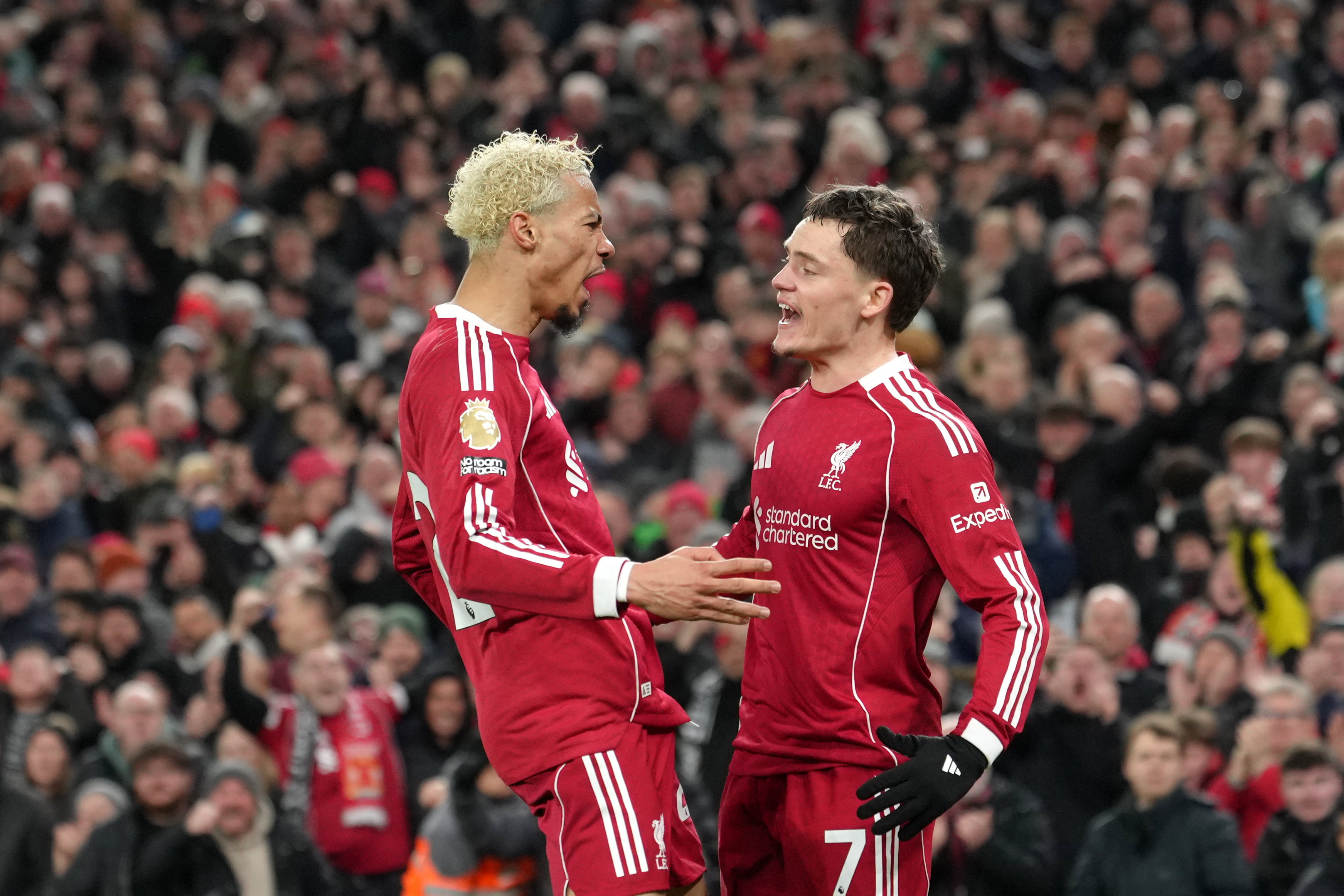 Liverpool's Hugo Ekitike, left, and Liverpool's Florian Wirtz celebrate scoring their side's first goal during the English Premier League soccer match between Liverpool and Newcastle in Liverpool, England, Saturday, Jan. 31, 2026.(AP Photo/Jon Super)