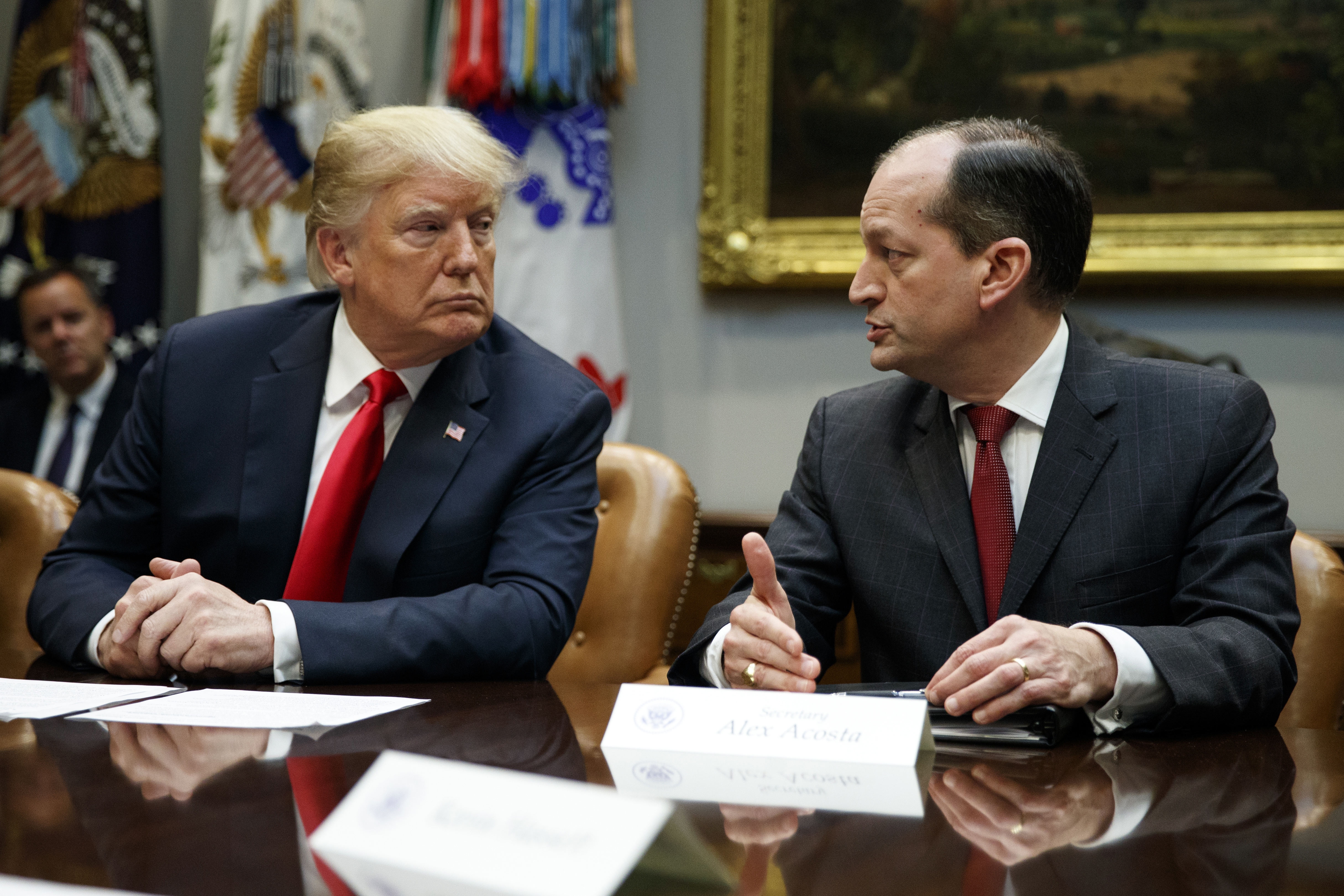 President Donald Trump listens as Labor Secretary Alex Acosta speaks during a meeting of the President's National Council of the American Worker in the Roosevelt Room of the White House, Monday, Sept. 17, 2018, in Washington. (AP Photo/Evan Vucci)