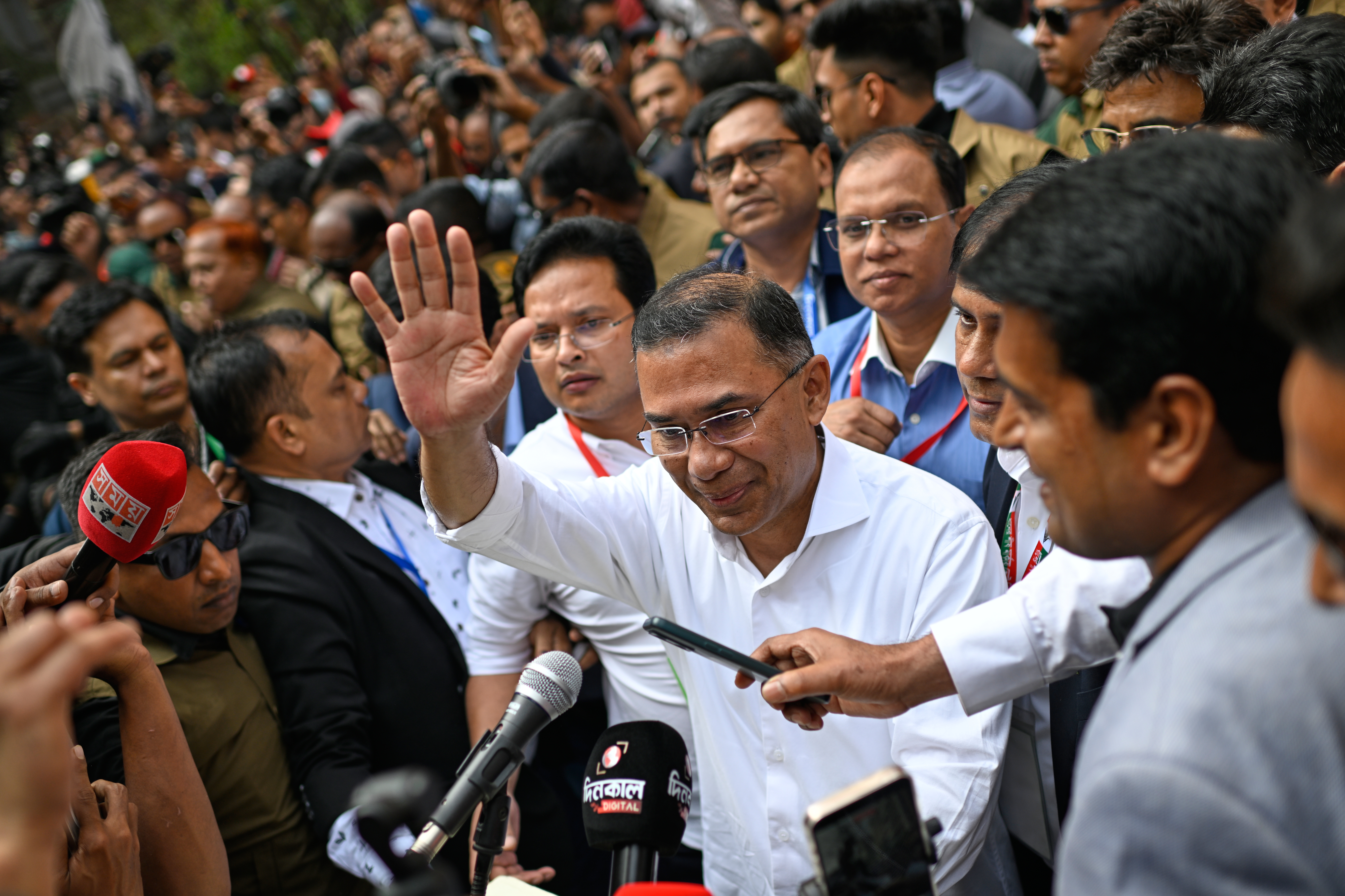 Bangladesh Nationalist Party Chairperson Tarique Rahman waves as he comes out after casting his vote during the national parliamentary elections in Dhaka, Bangladesh, Thursday, Feb. 12, 2026. (AP Photo/Mahmud Hossain Opu)