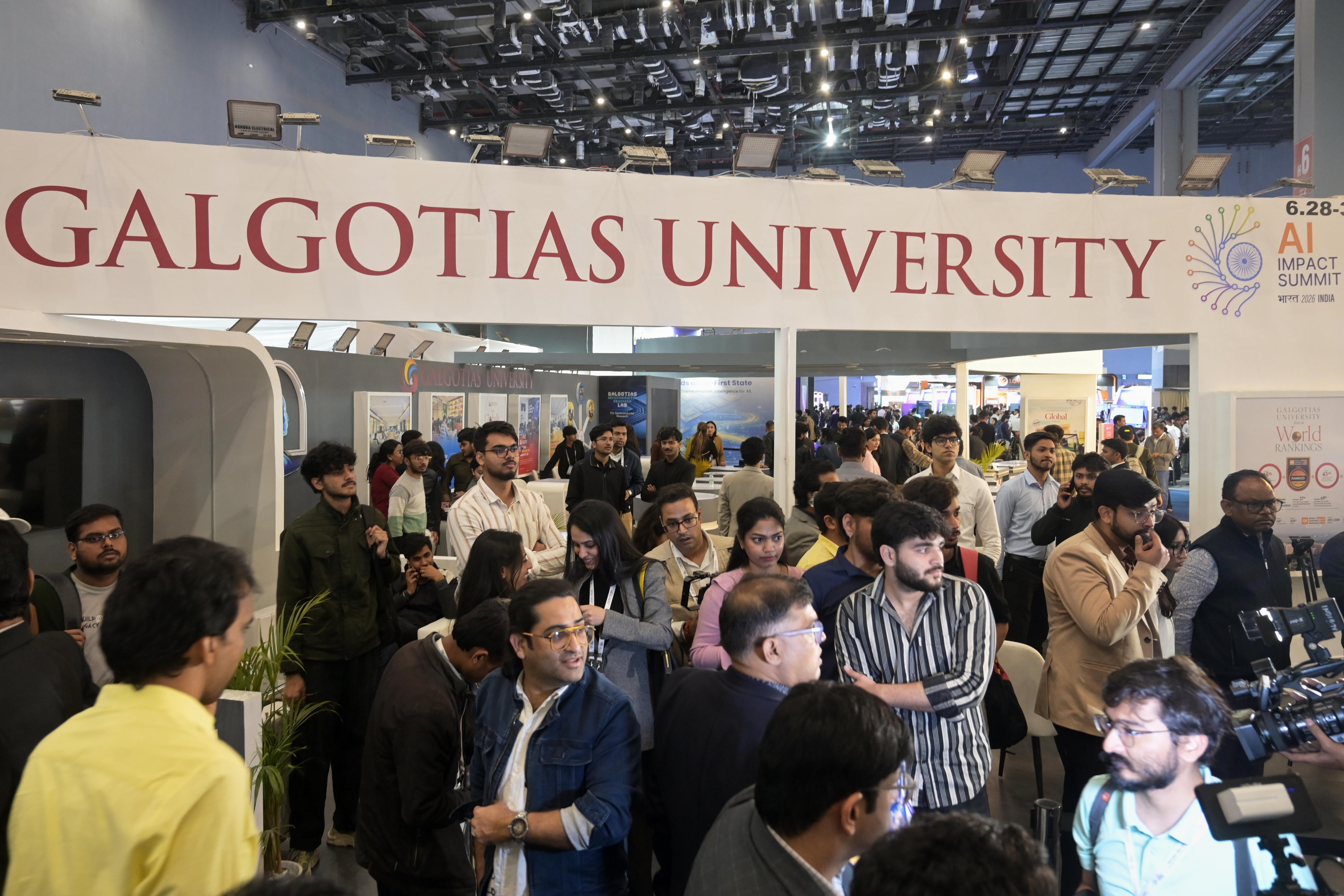 People visit Galgotias University stall at AI summit ahead of an eviction order issued by Indian authorities, in New Delhi, India, Wednesday, Feb. 18, 2026. (AP Photo)