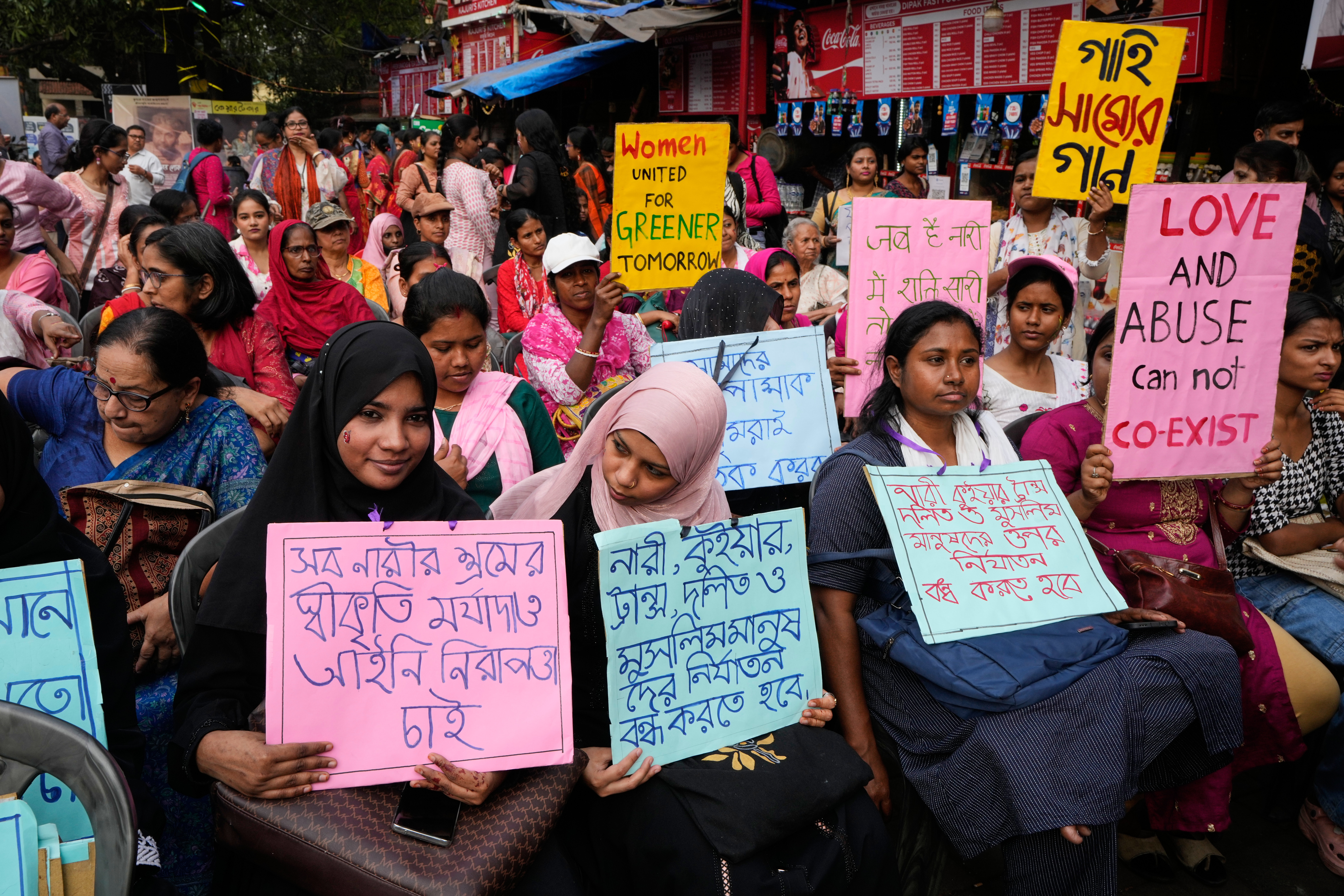 Activists with posters attend a rally during a "One Billion Rising" event, a global campaign calling for an end to violence against women and girls, in Kolkata, India, Tuesday, Feb. 24, 2026. (AP Photo/Bikas Das)