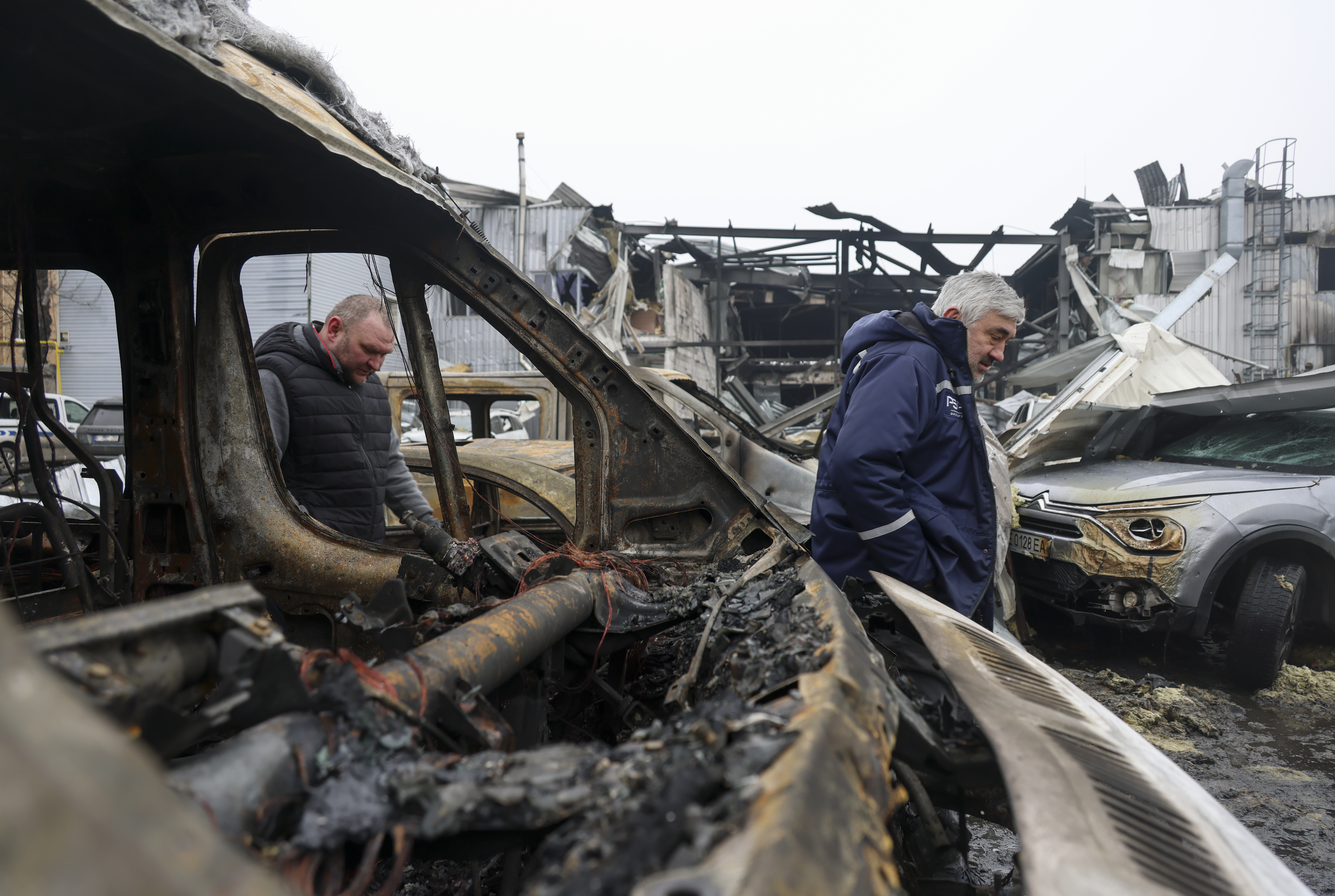 epa12734232 Ukrainian people survey the site of the overnight Russian attack on the residential area in Odesa, Ukraine, 13 February 2026, amid the ongoing Russian invasion. At least one person was killed, and six others were injured during the Russian attack in Odesa, according to the State Emergency Service. EPA/IGOR MASLOV 110091