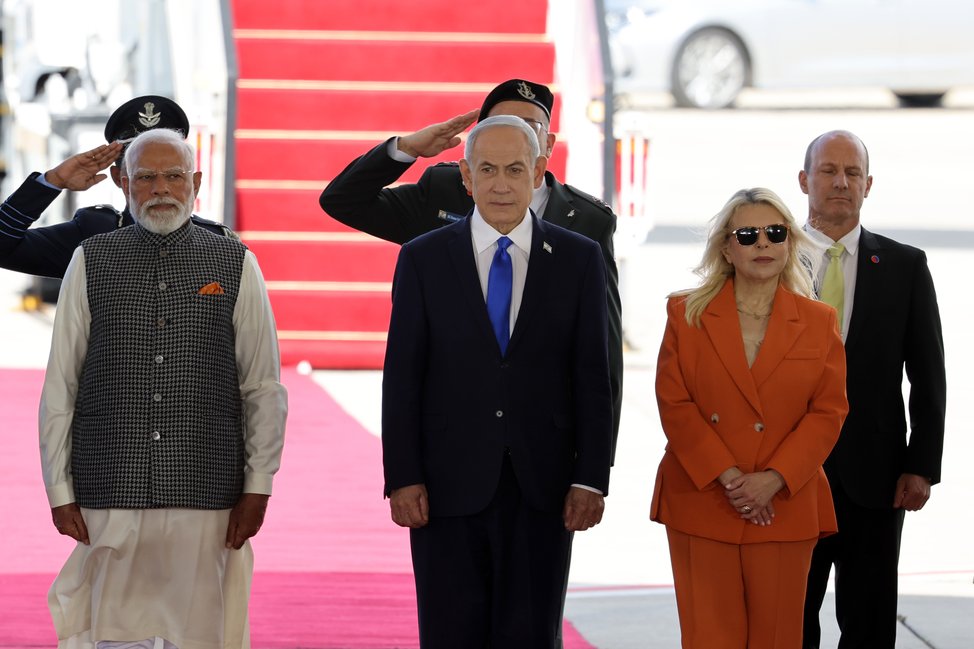 epa12775751 Indian Prime Minister Narendra Modi (L) is welcomed by Israeli Prime Minister Benjamin Netanyahu and Sara Netanyahu during a welcome ceremony at the Ben Gurion International Airport near Tel Aviv, Israel, 25 February 2026. Modi is on a two-day official visit to Israel. EPA/ABIR SULTAN