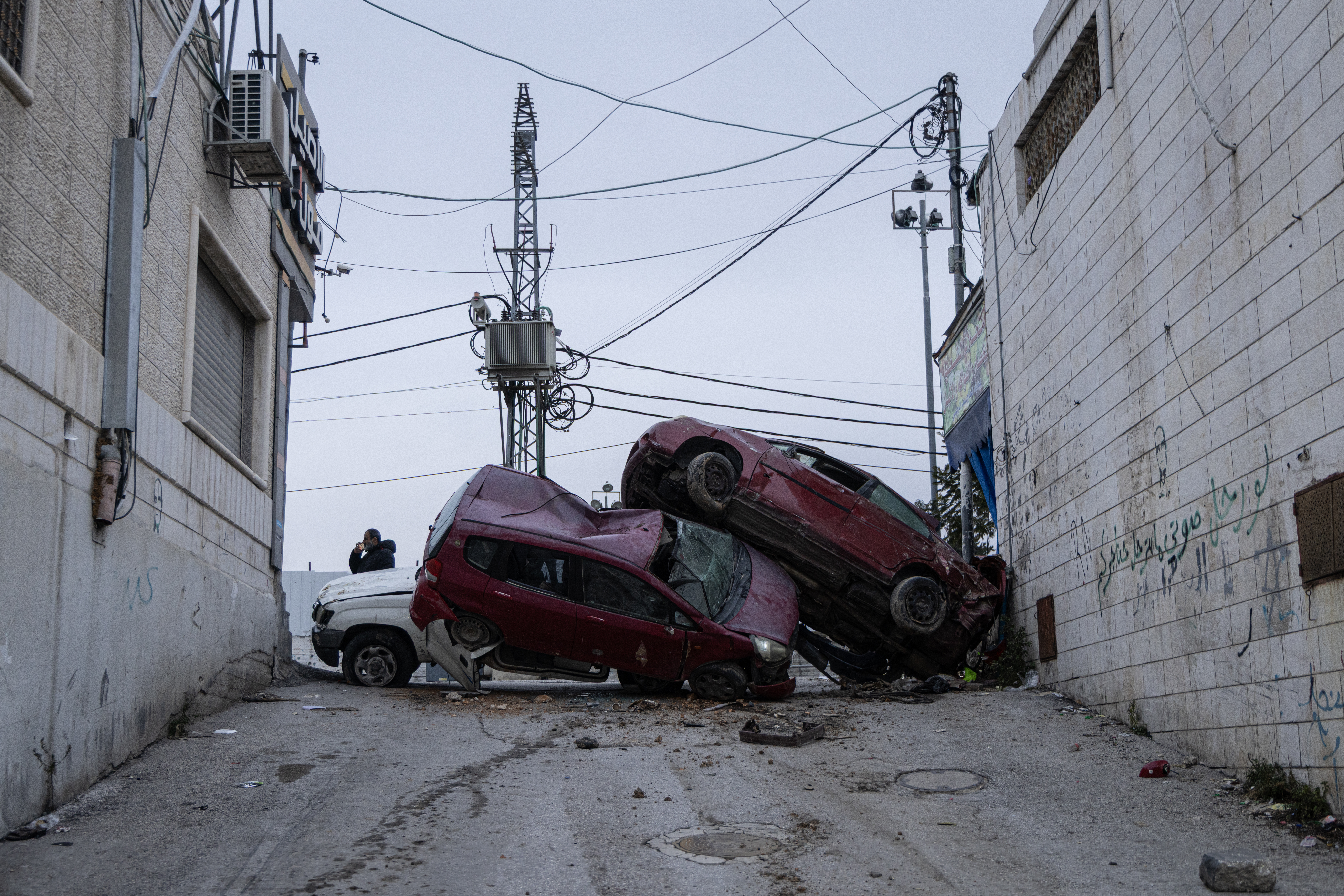 Vehicles destroyed by the Israeli army and placed as barriers to block roads leading to the Jabal Johar area in Hebron, occupied West Bank