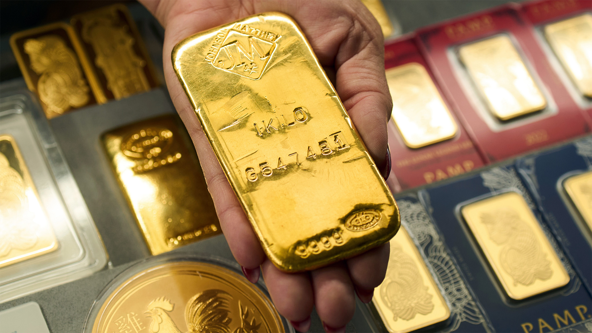 Sam Nguyen shows a gold bar at her shop in the St. Vincent Jewelry Center in the Jewelry District of Los Angeles, Wednesday, April 30, 2025. (AP Photo/Jae C. Hong, File)