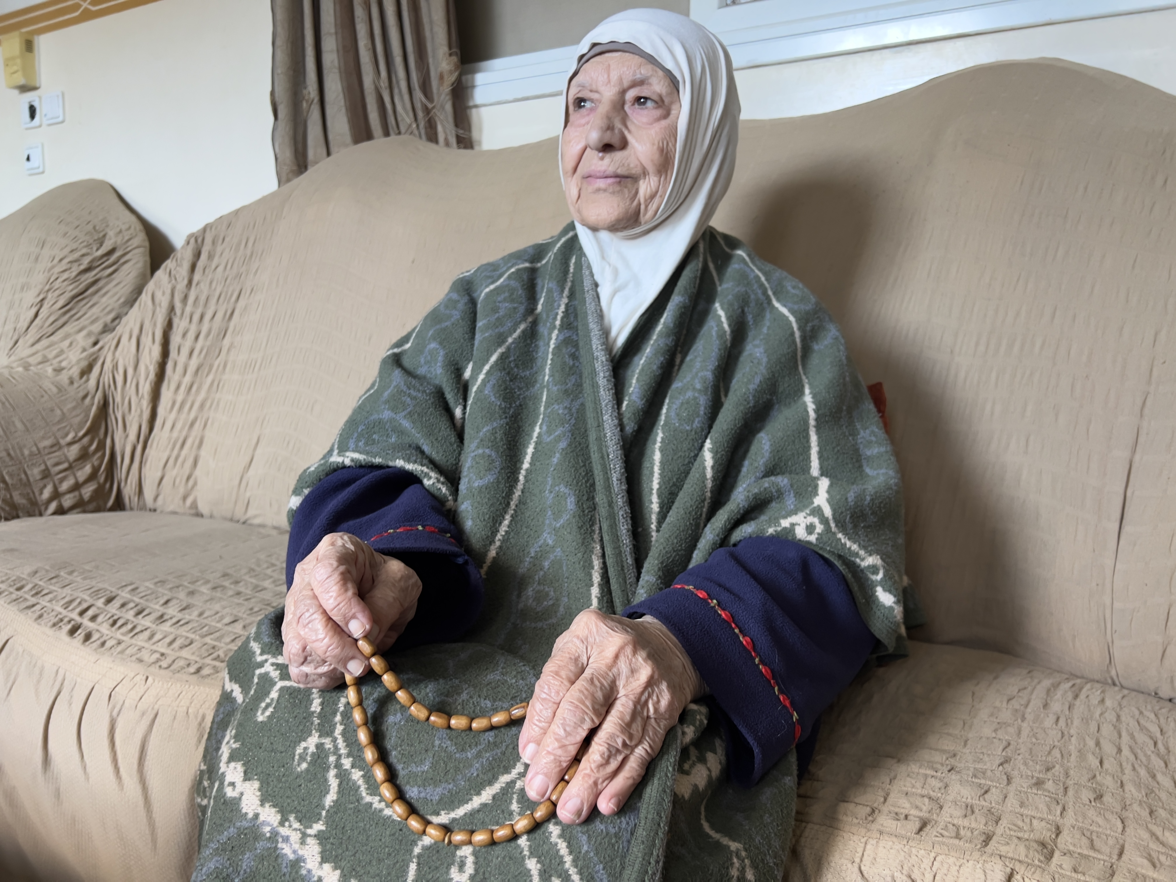 Nazmeya Radwan, 85, refugee since 1948, from the Jerusalem district, displaced in Deir al-Balah [Ola al-Asi/Al Jazeera]