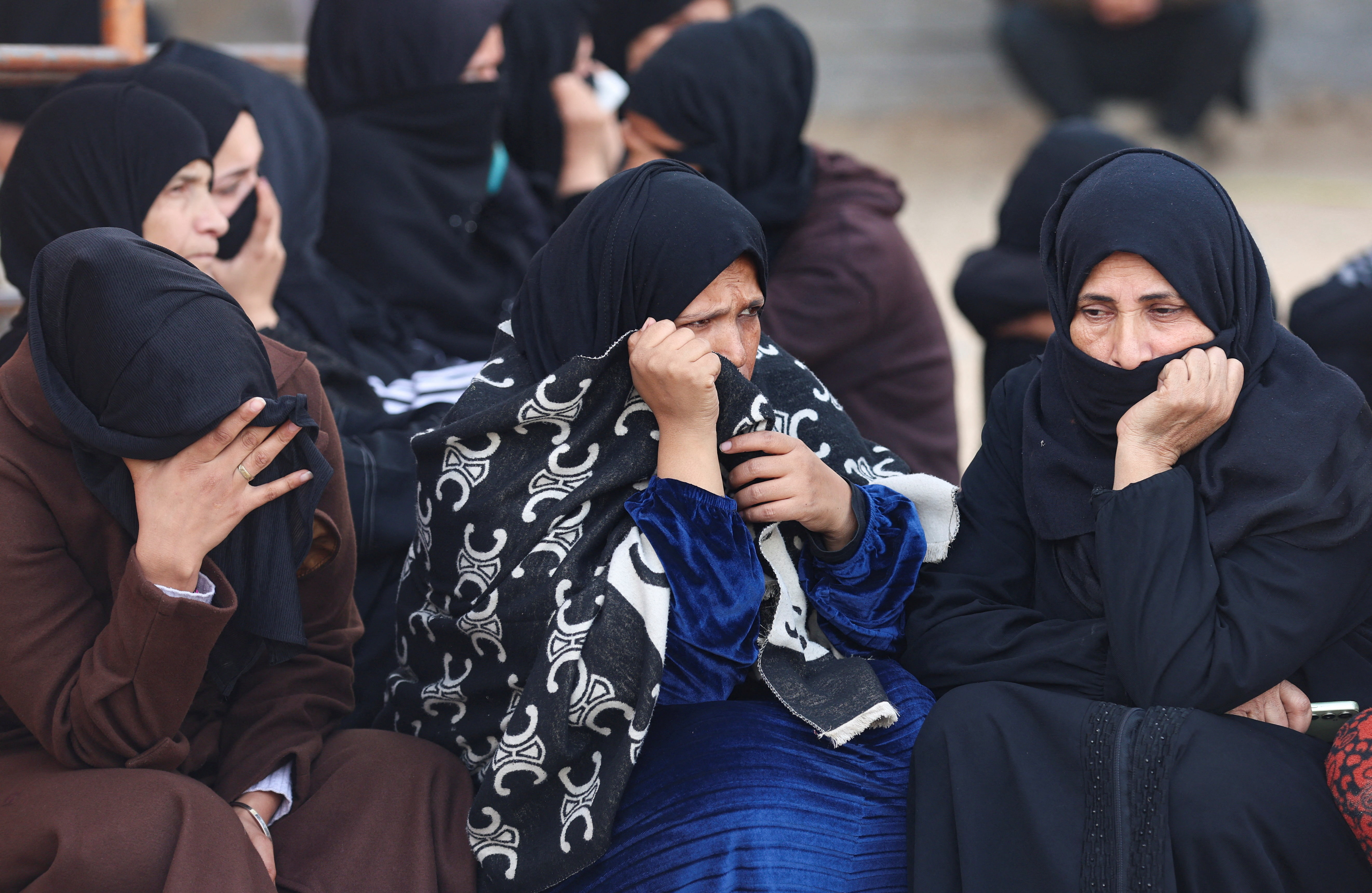 Mourners attend the funeral of Palestinians killed in an overnight Israeli strike, according to medics, at Nasser Hospital in Khan Younis in the southern Gaza Strip, February 15, 2026. REUTERS/Ramadan Abed