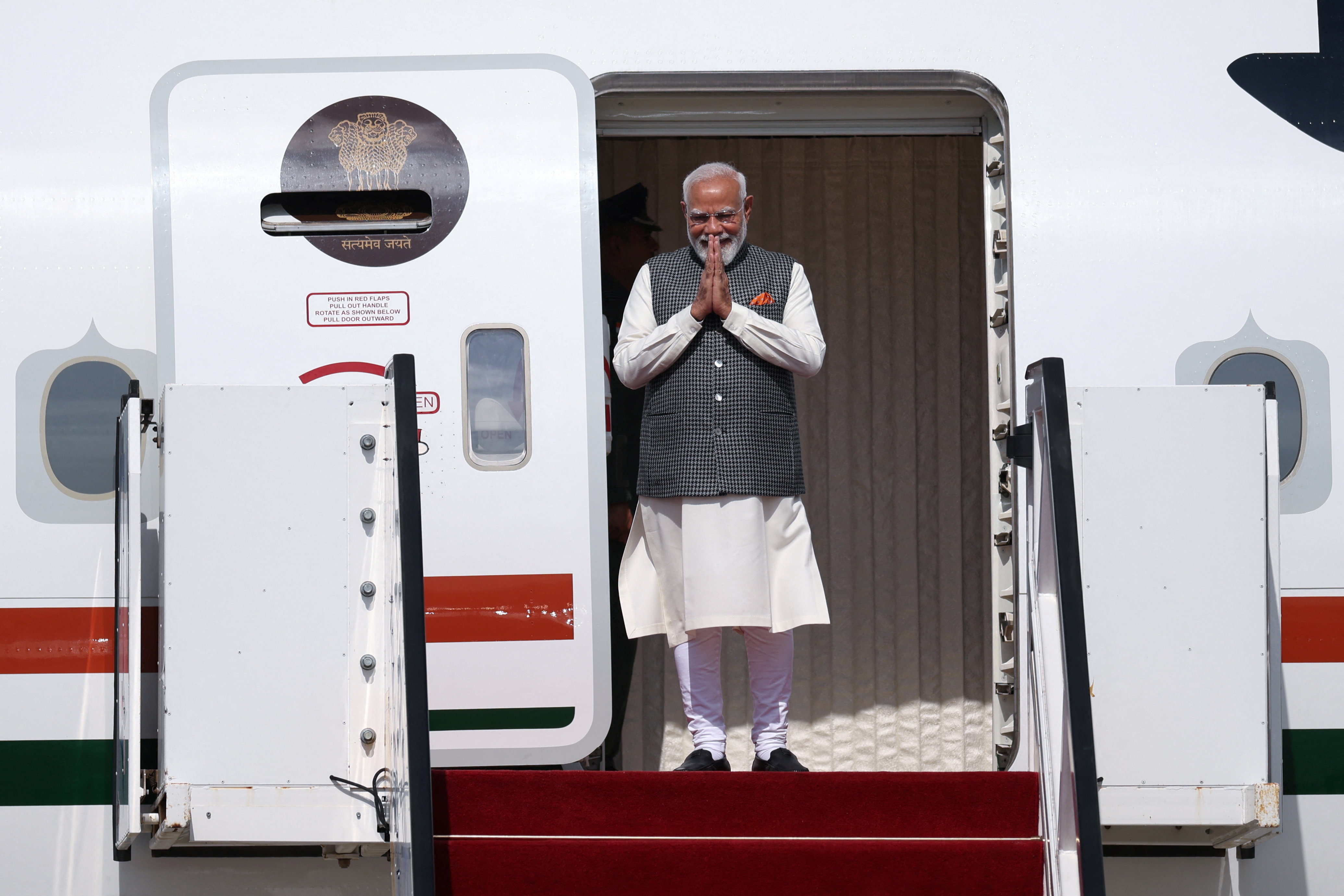 India's Prime Minister Narendra Modi disembarks a plane as he arrives at Ben Gurion International Airport in Lod, near Tel Aviv, Israel February 25, 2026. REUTERS/Shir Torem