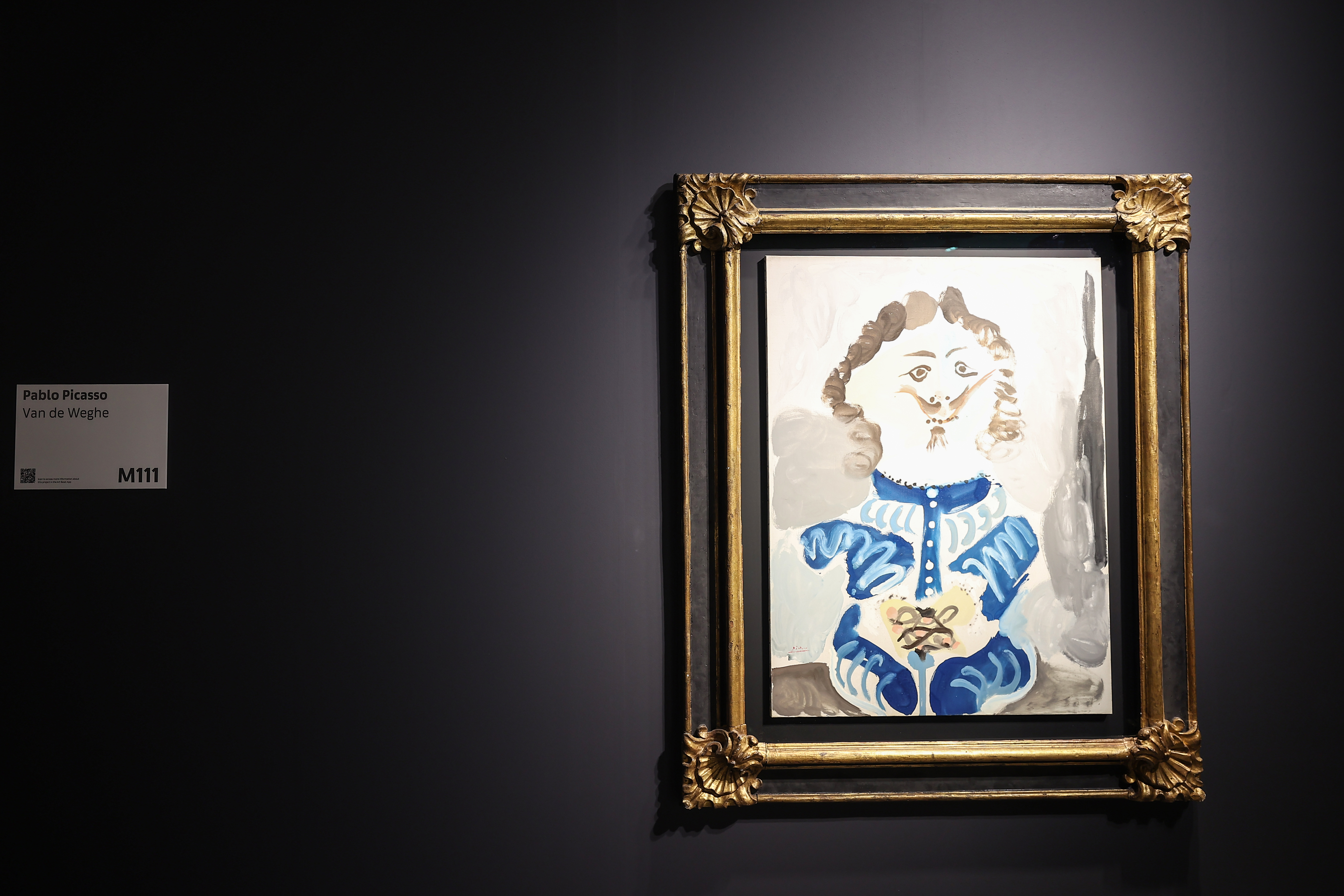 Visitors explore artworks and installations at the Art Basel Qatar Edition in Doha