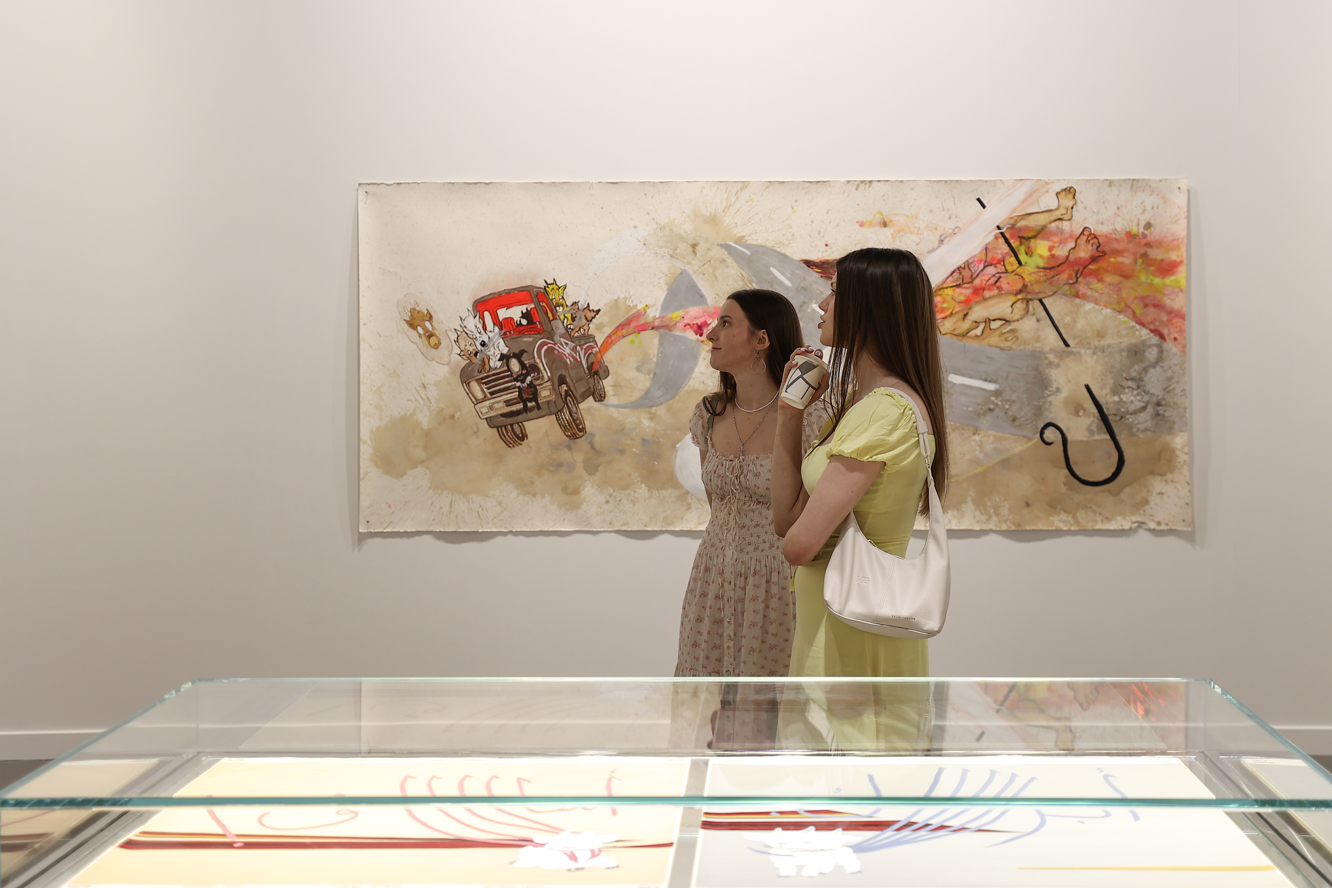 Visitors explore artworks and installations at the Art Basel Qatar Edition in Doha